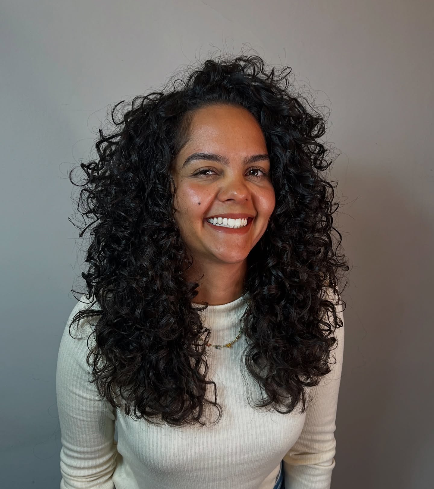 Dynamic Curly Layered Shag with Fluffy Volume