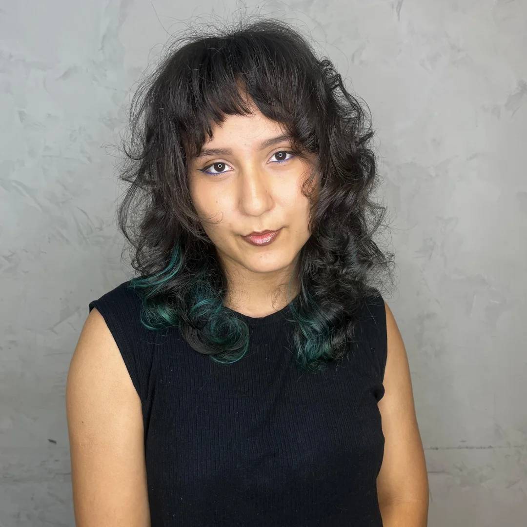 Playful Curly Shag with Teal Highlights
