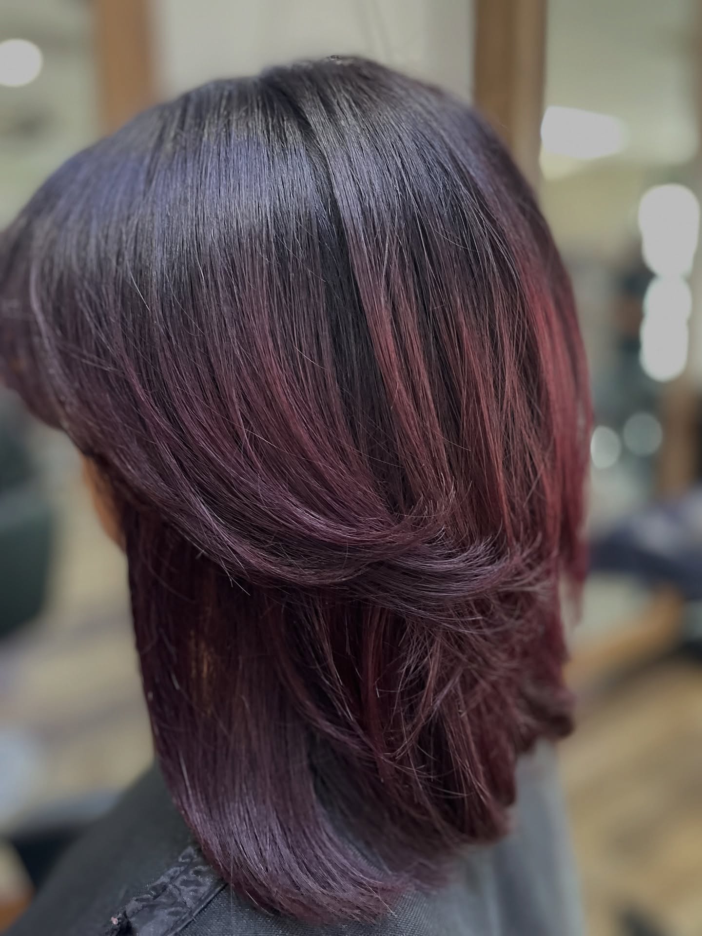 Chic Layered Cut with Burgundy Highlights