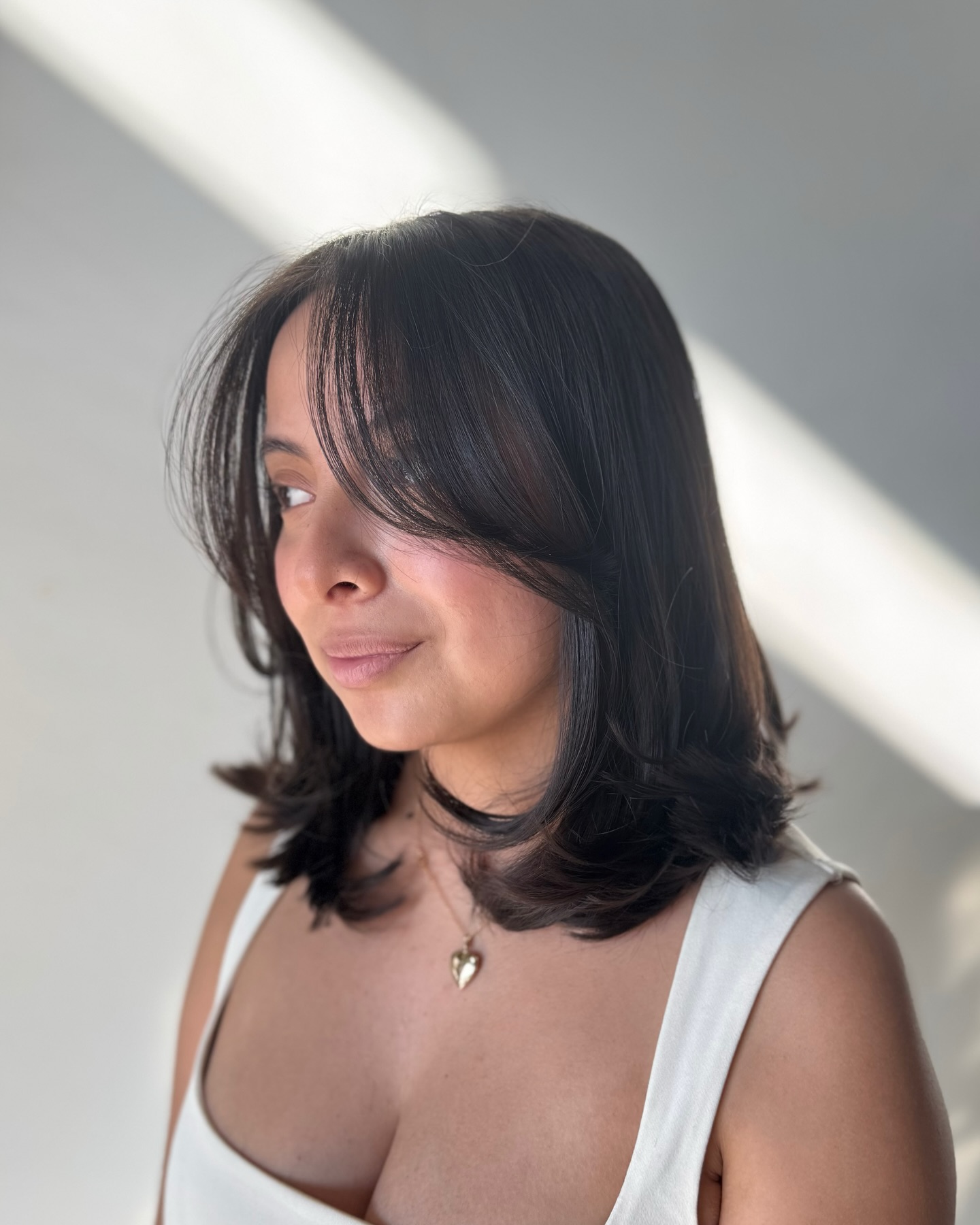 Soft Layered Cut with Face-Framing Bangs