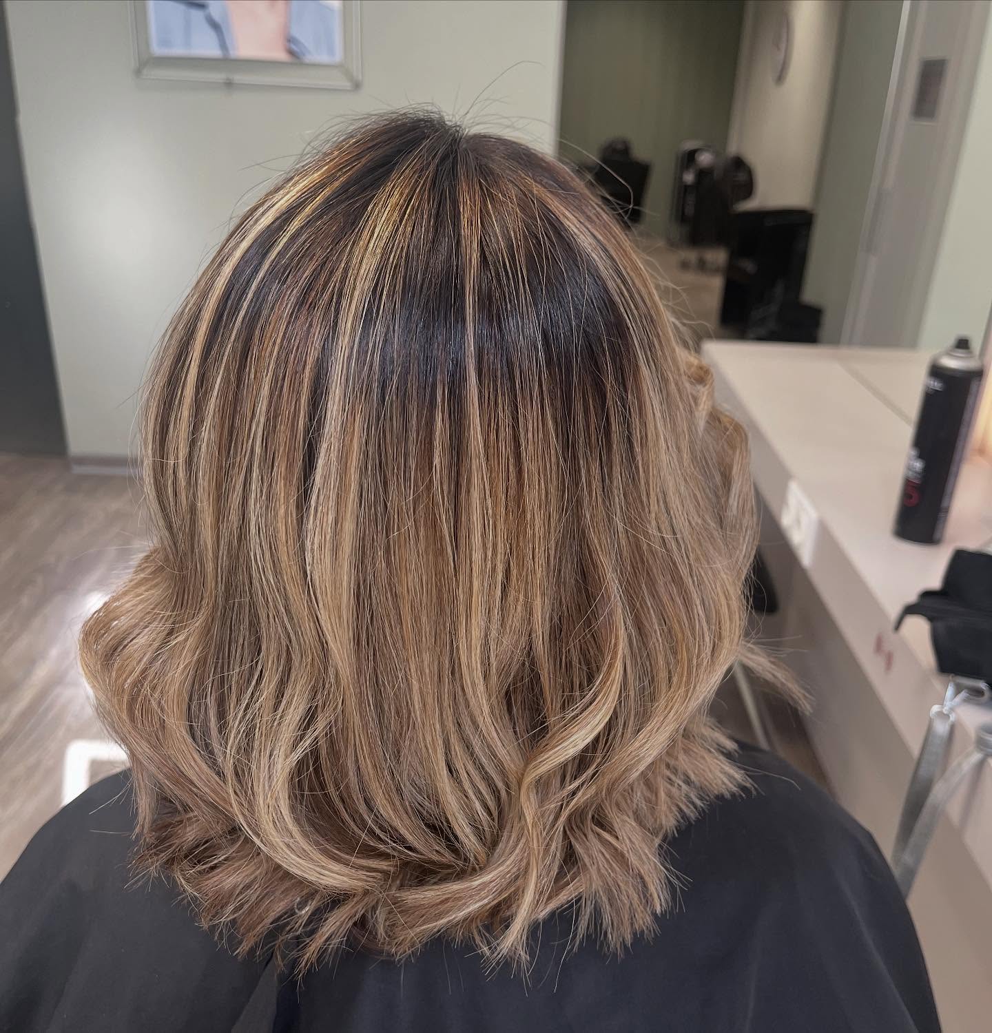 Stylish Layered Cut with Sun-Kissed Highlights