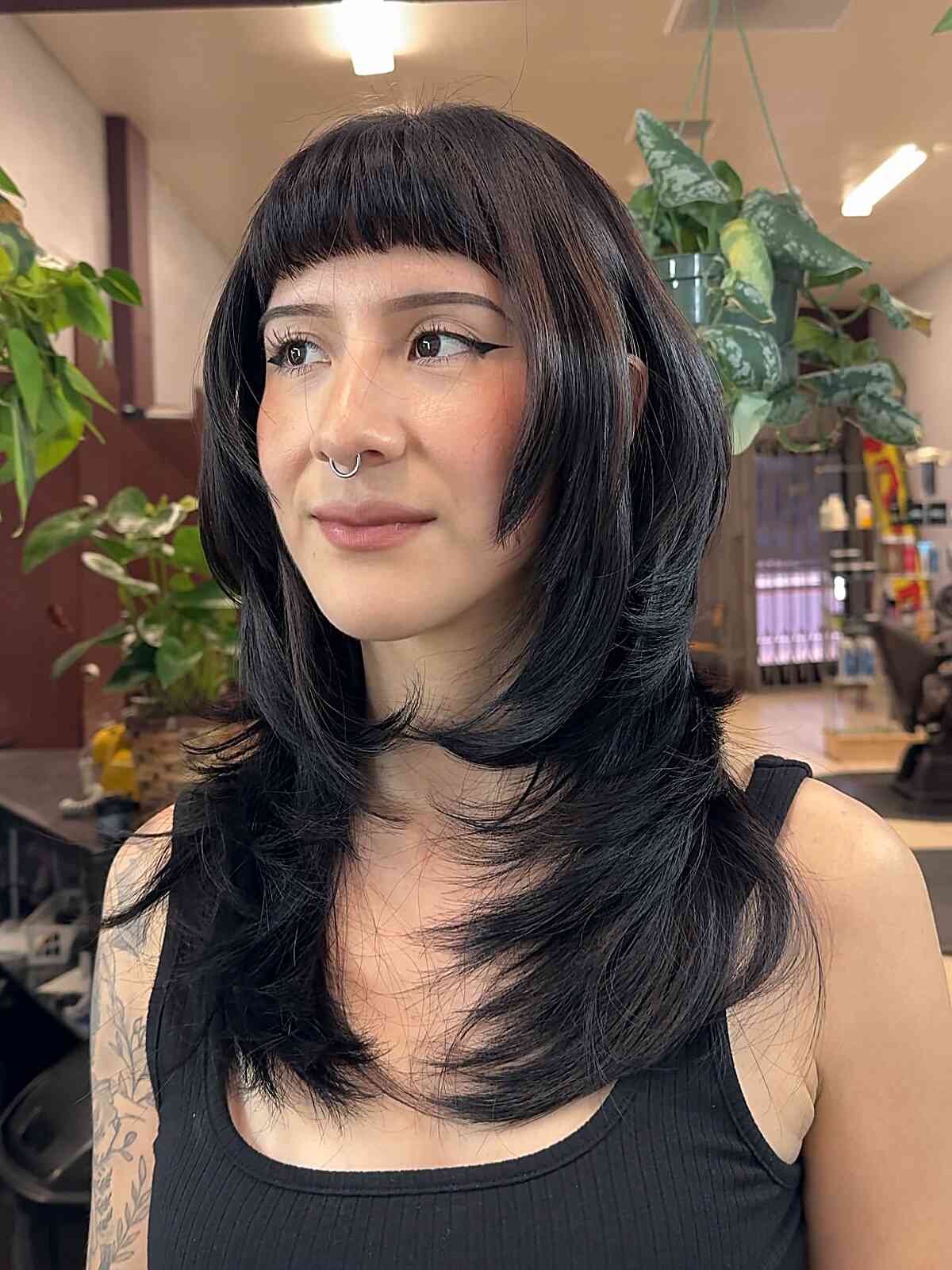 Edgy Textured Haircut with Bold Bangs