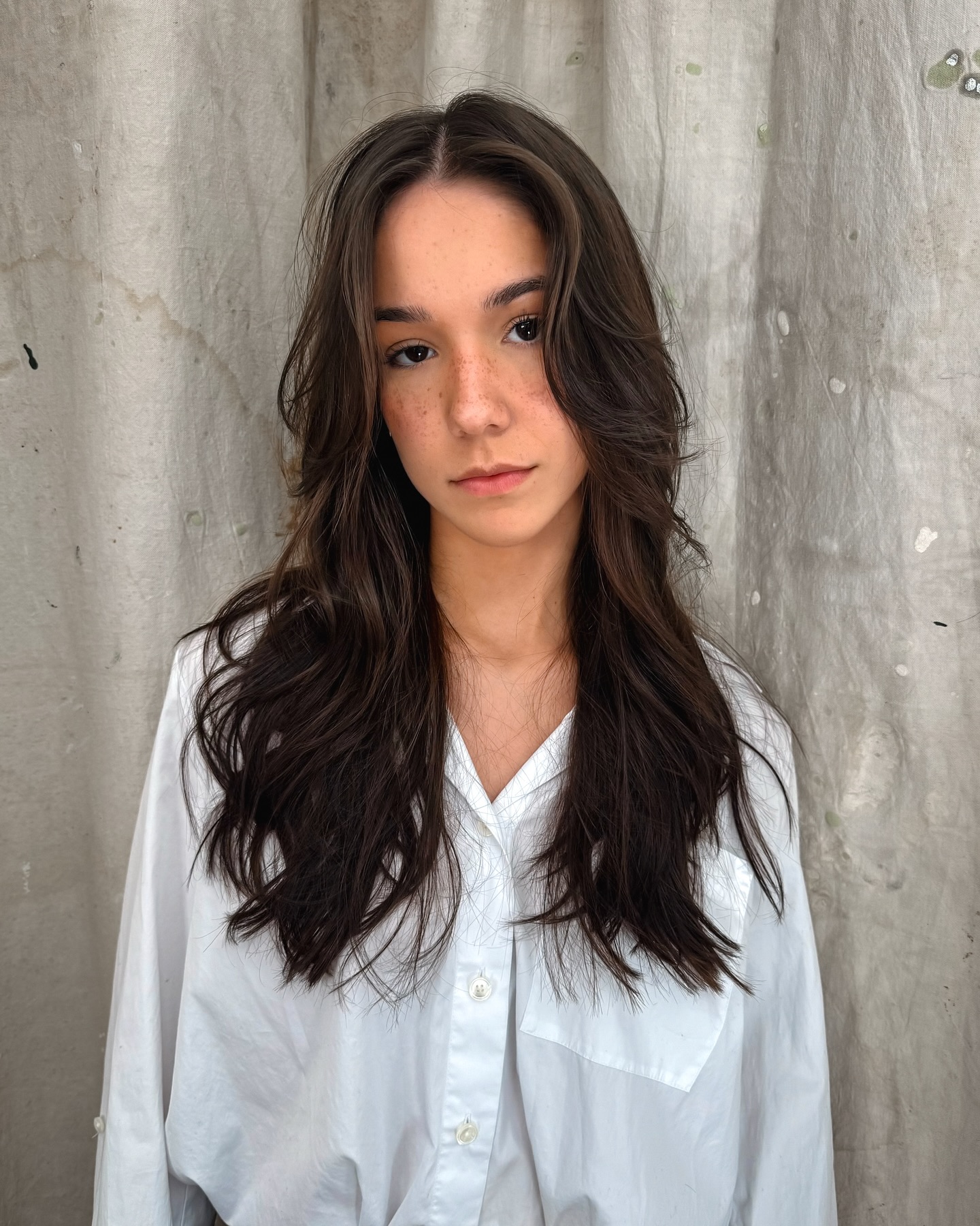 Flowing Chocolate Waves with Feathered Curtain Bangs