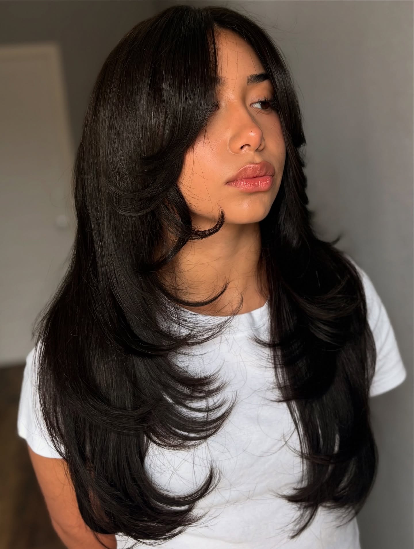 Luxurious Chestnut Layers with Soft Curtain Bangs