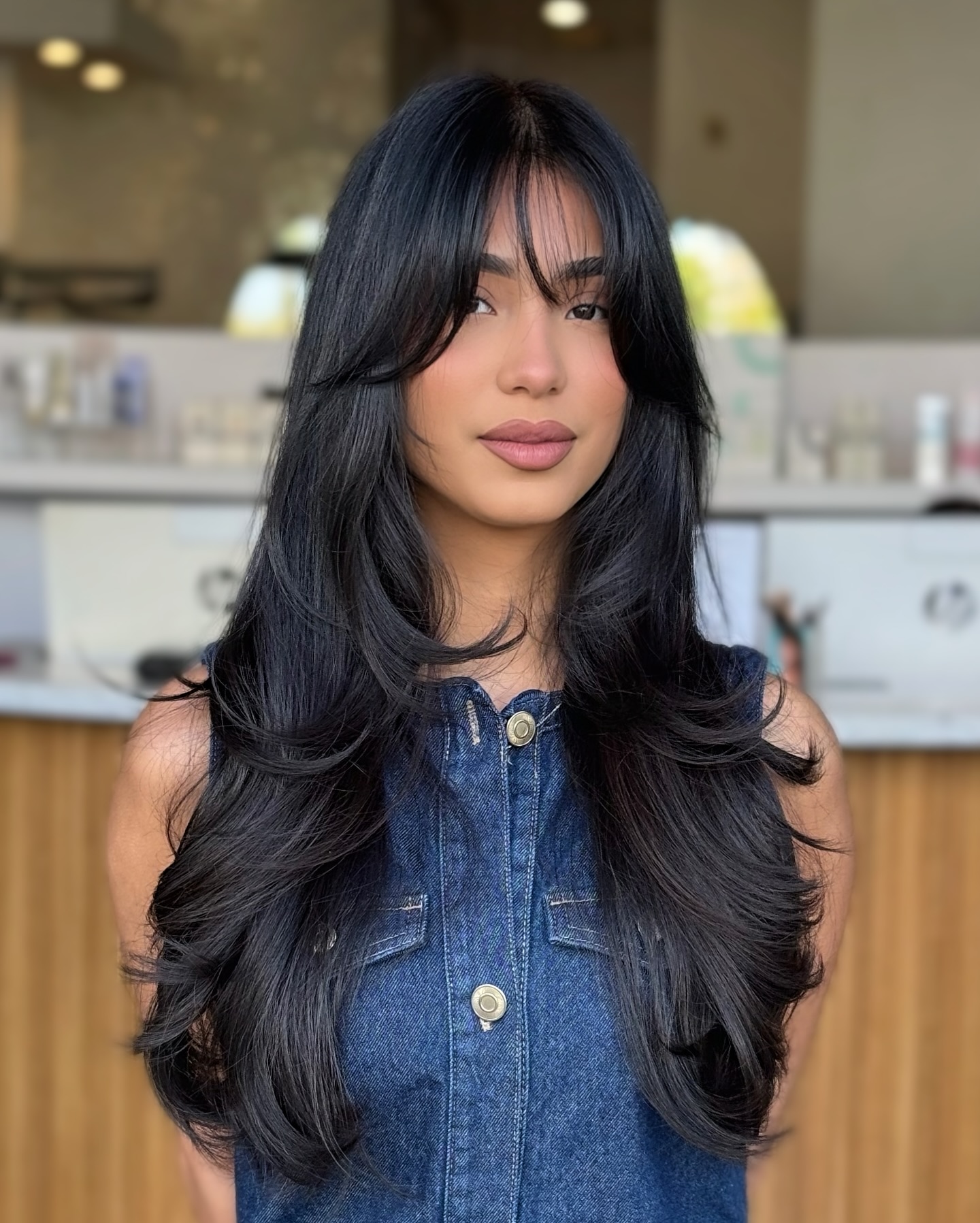 Midnight-Black Layers with Subtle Curtain Bangs
