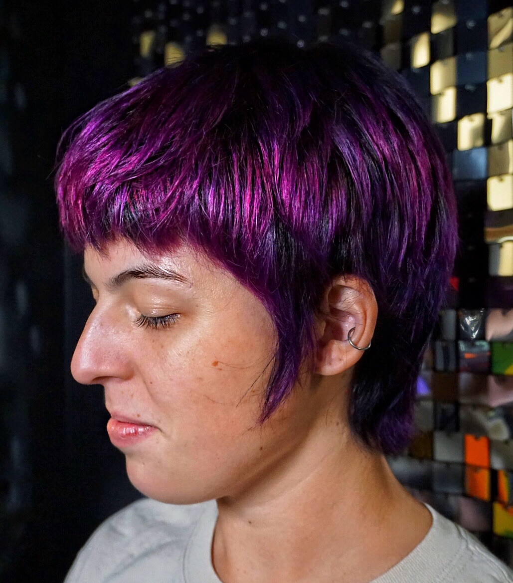 Bold Funky Pixie Cut with Vibrant Purple Highlights