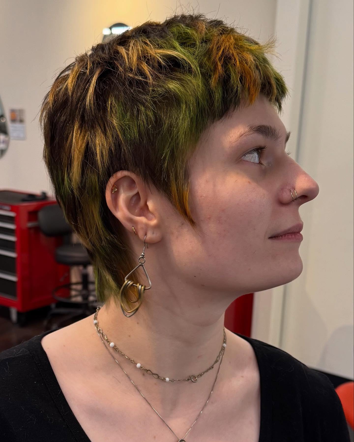 Edgy Textured Funky Pixie with Bold Green and Gold Highlights