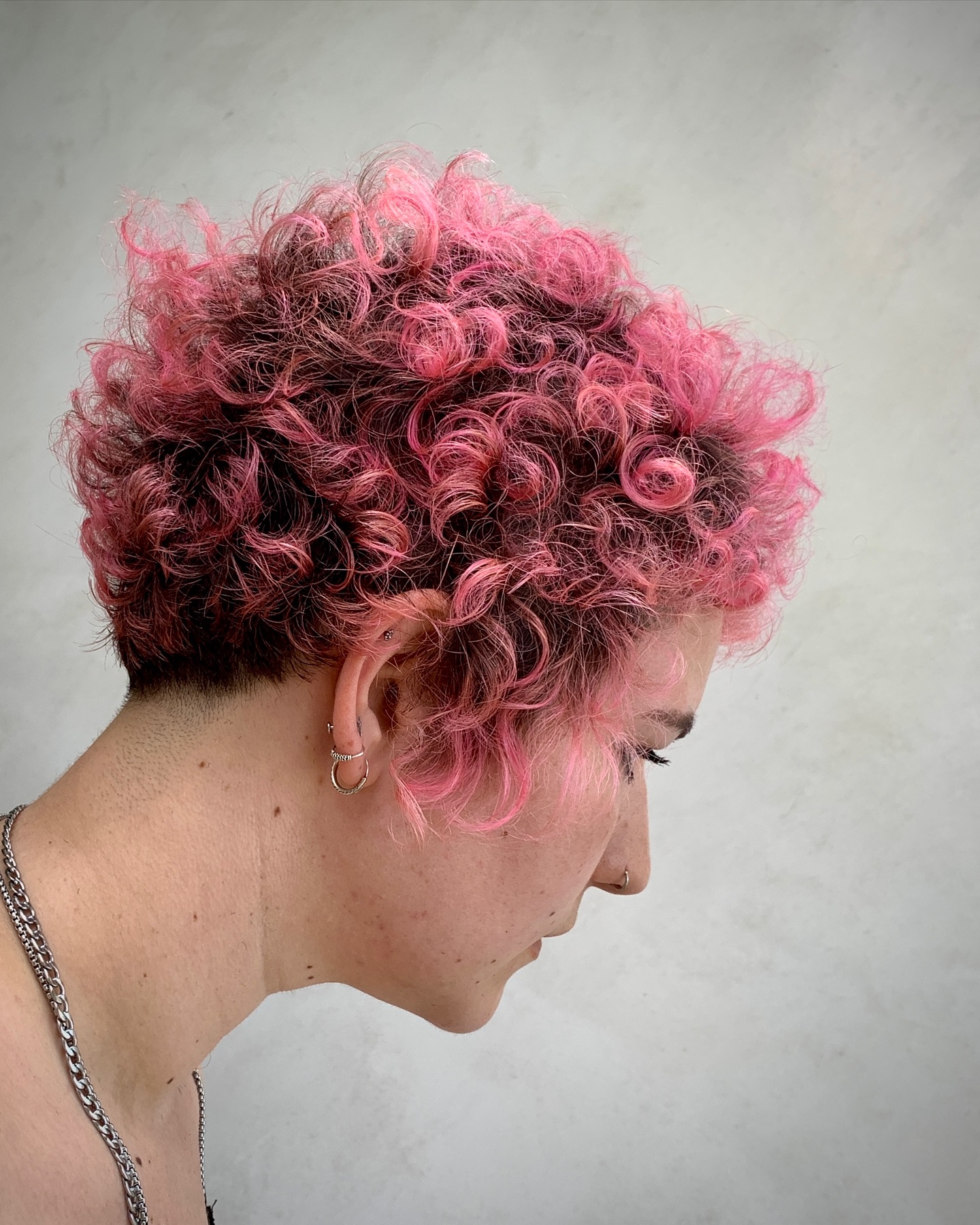 Funky Curly Pixie with Bold Pink Highlights