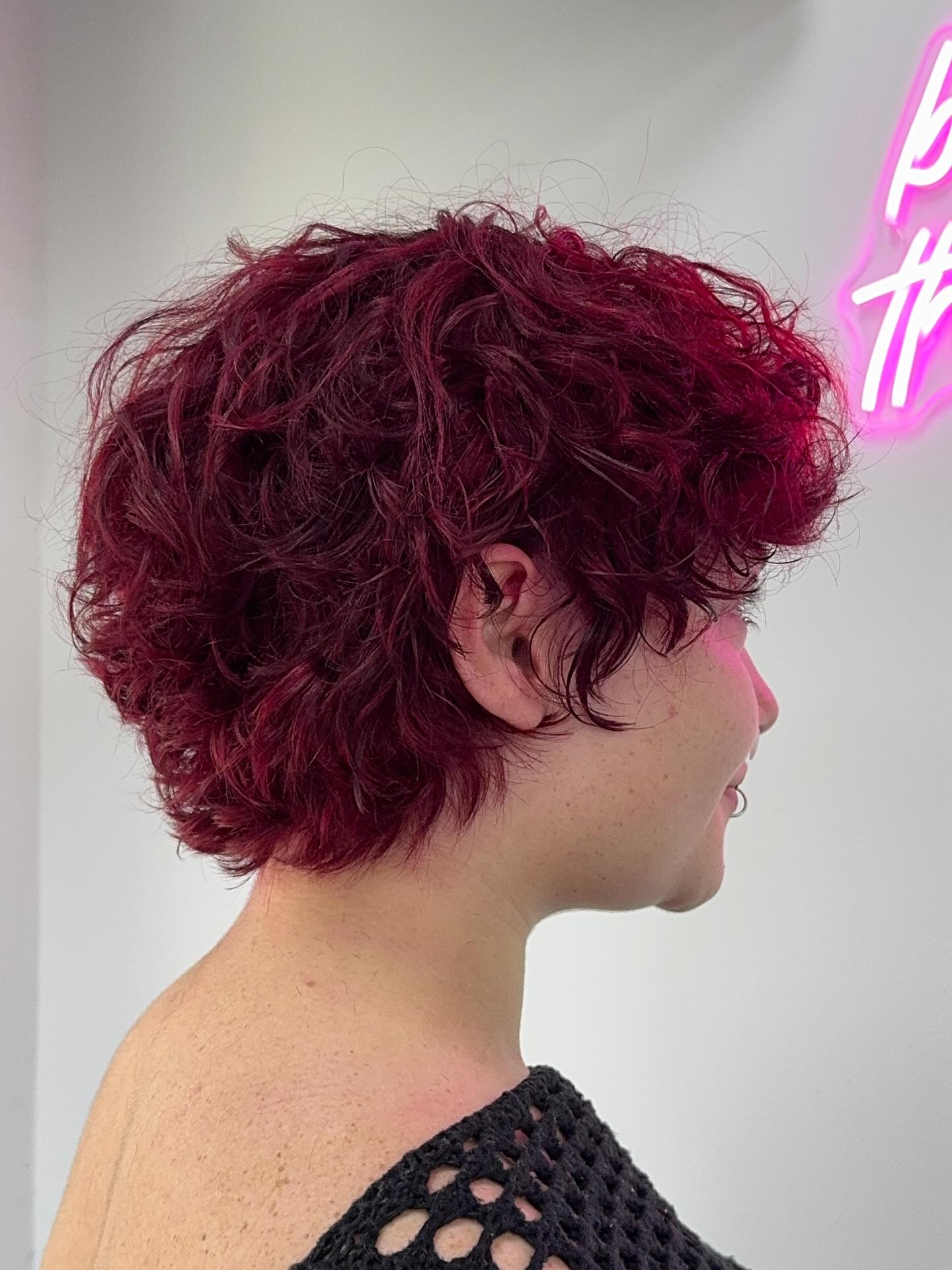Textured Curly Funky Pixie with Bold Crimson Tones