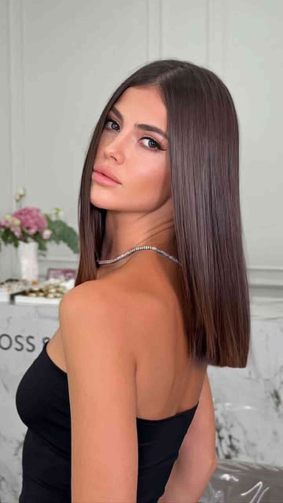 Sleek Straight Hair with a Middle Part