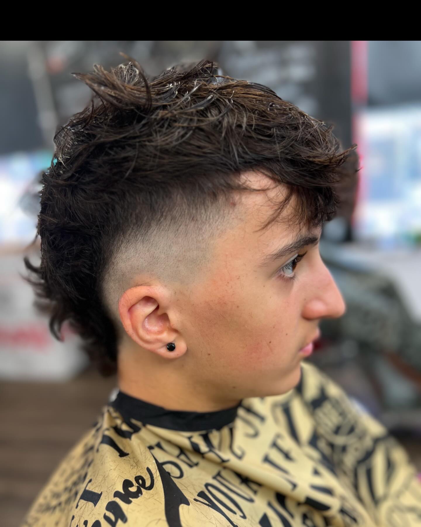 Textured Burst Fade Mohawk with Curly Top