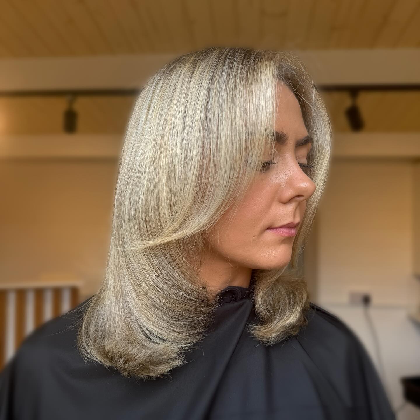 Beautifully Layered Blonde Shoulder-Length Hair with Subtle Face-Framing Layers