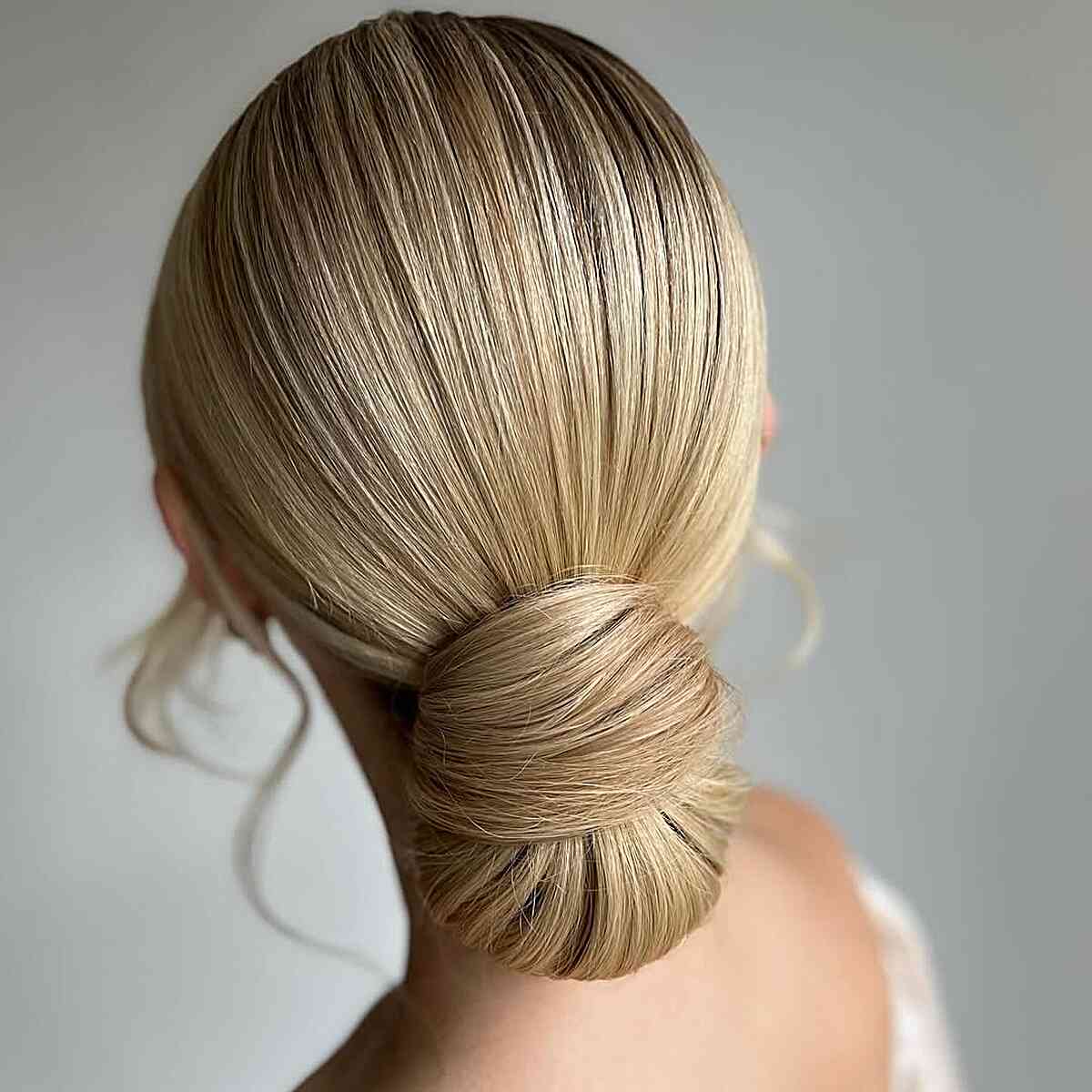 Sleek Low Chignon with Glossy Finish