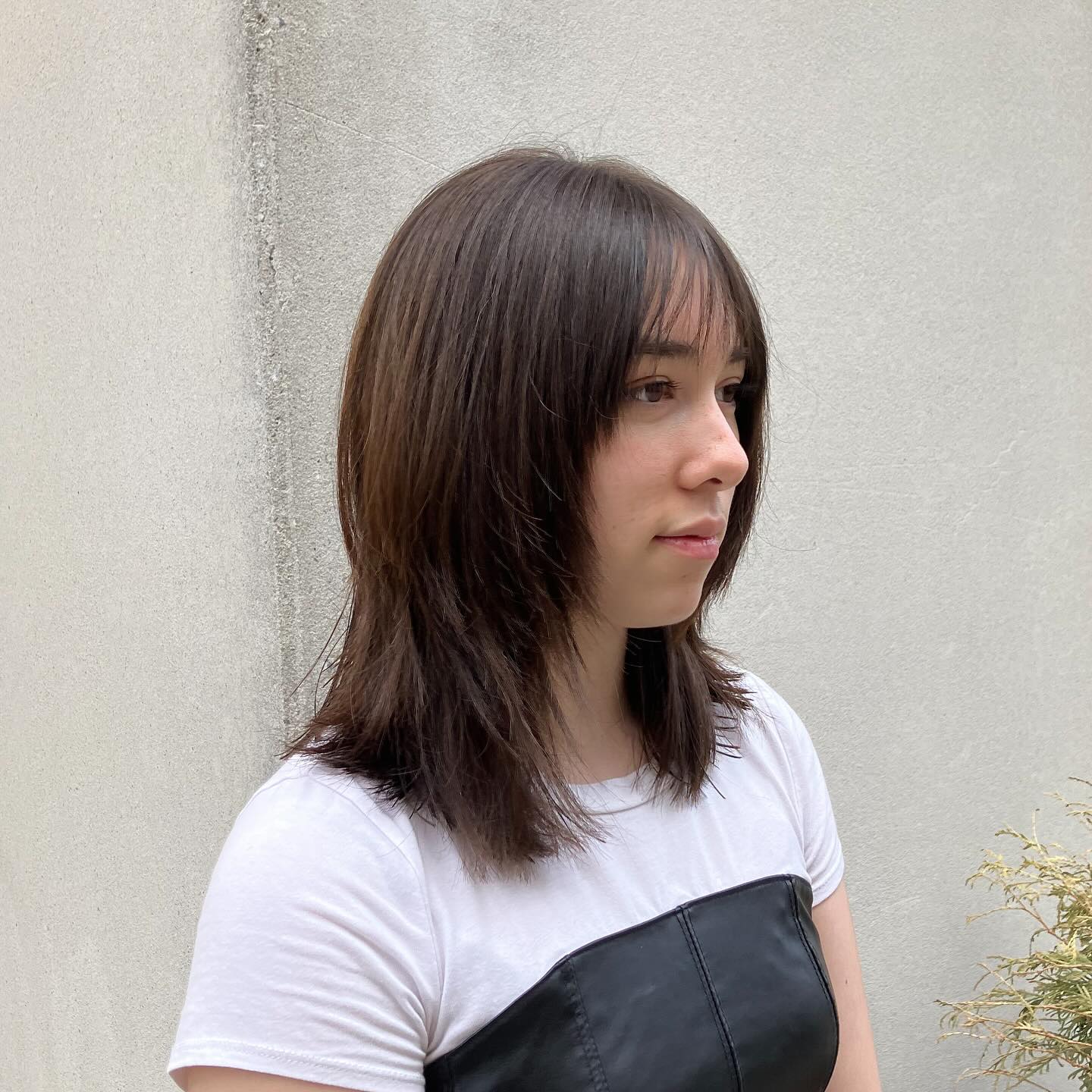 Stylish Layered Shoulder-Length Cut with Soft Textured Bangs