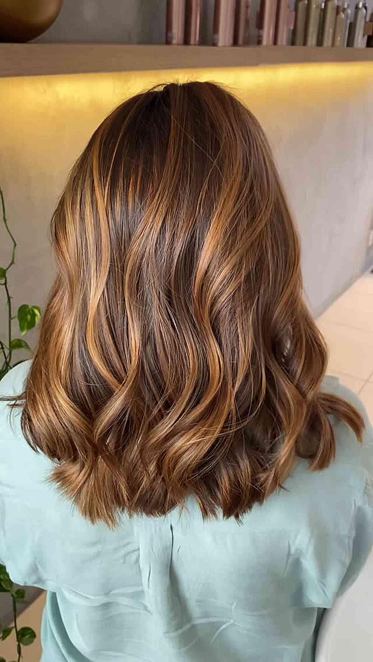 Stylish Medium Length Caramel Balayage with Soft Waves