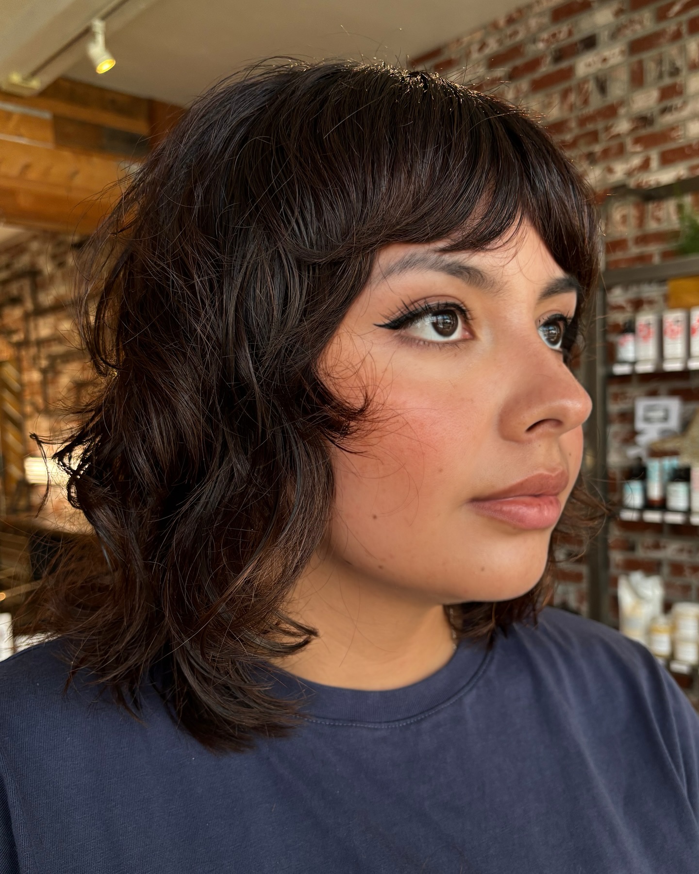 Textured Shoulder-Length Cut with Soft Curved Bangs
