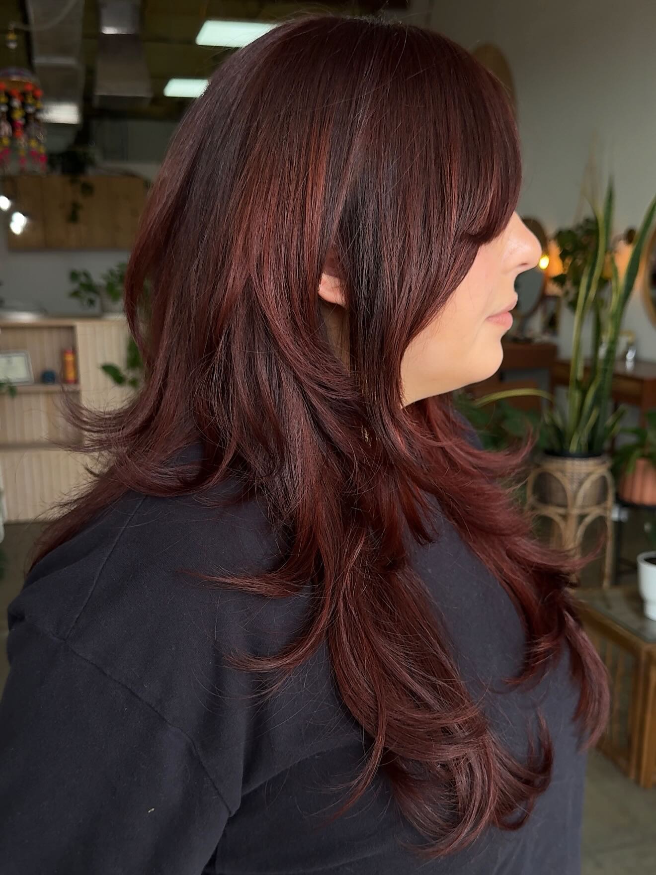 Glossy Deep Burgundy Layered Cut with Face-Framing Bangs