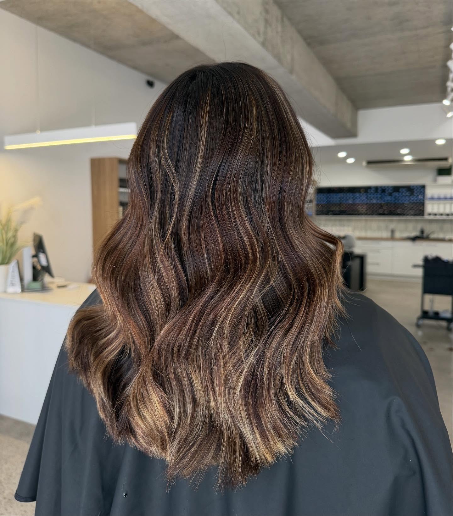 Chic Brunette Waves with Subtle Caramel Highlights