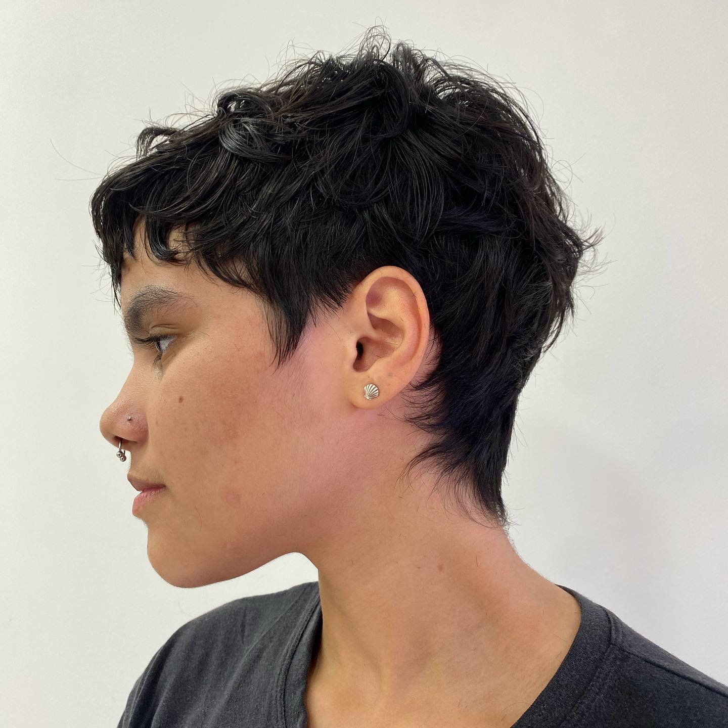 Daring Black Textured Pixie with Curled Bangs
