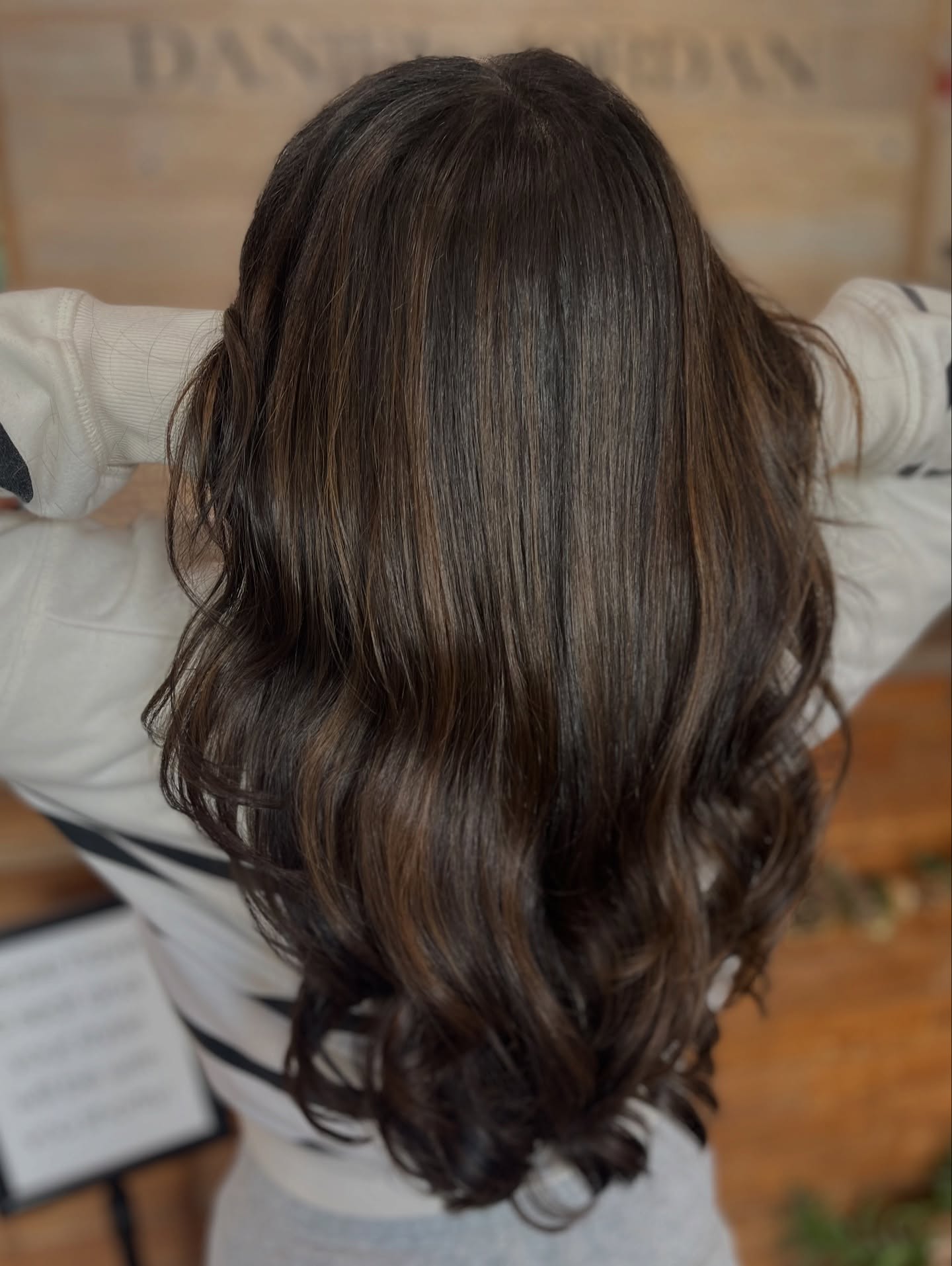Elegant Brunette Waves with Subtle Caramel Highlights