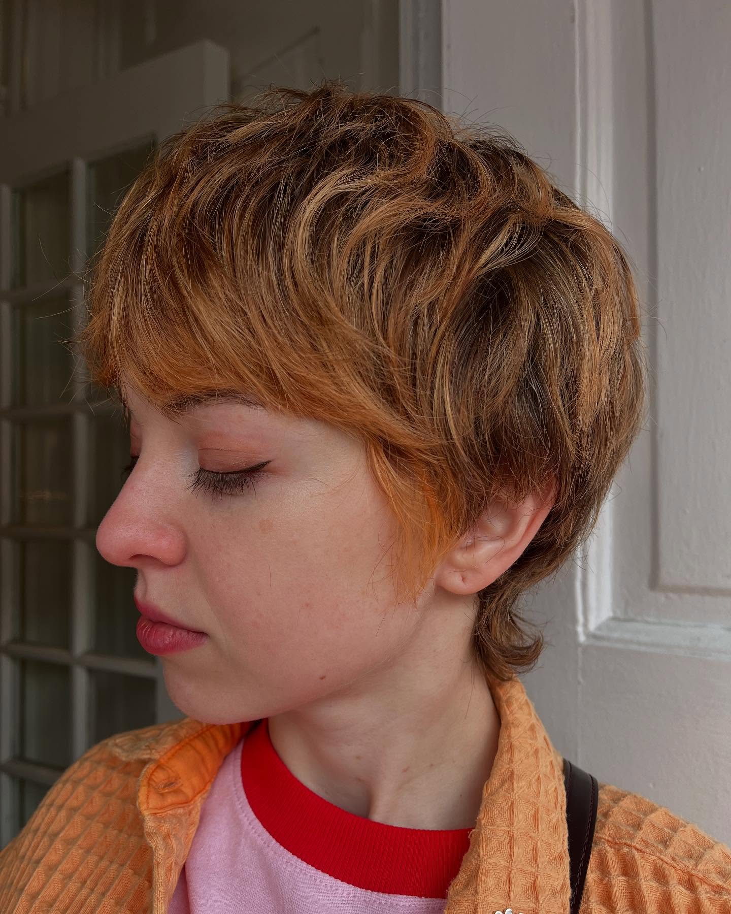 Golden-Toned Tousled Pixie Cut with Subtle Undercut