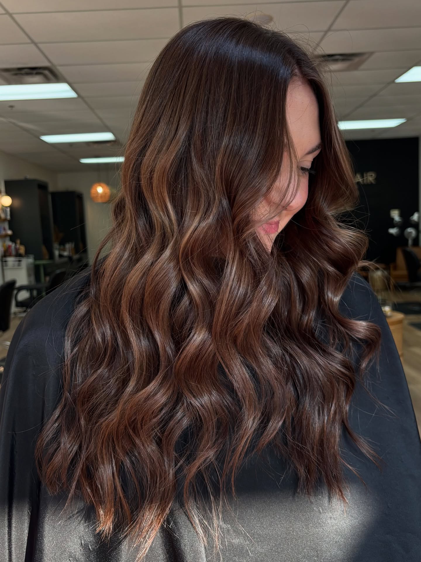 Radiant Brunette Waves with Subtle Dimension