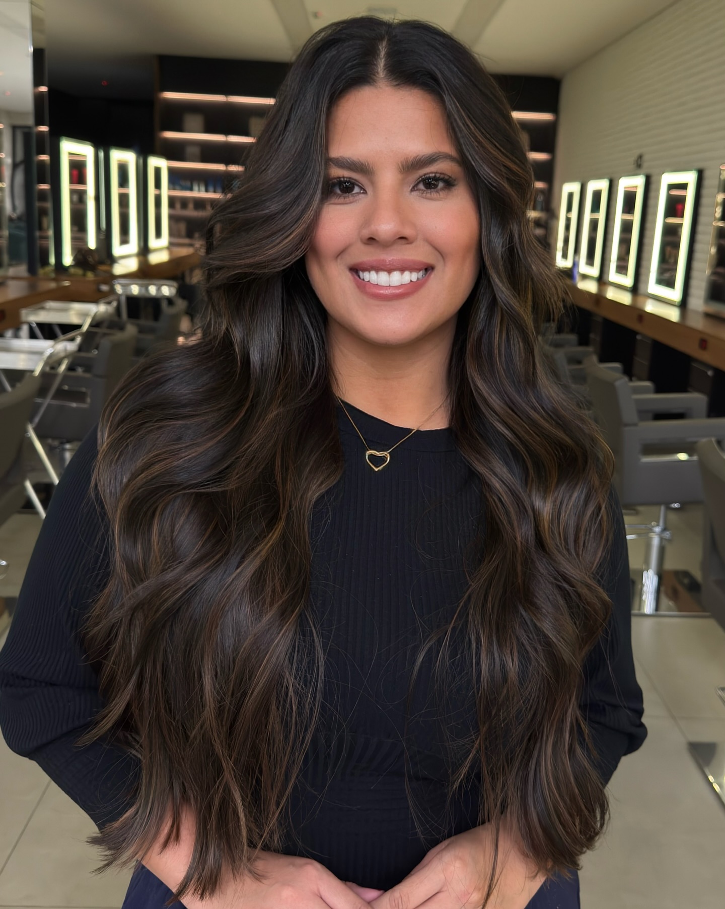 Voluminous Brunette Waves with Soft Face-Framing Layers