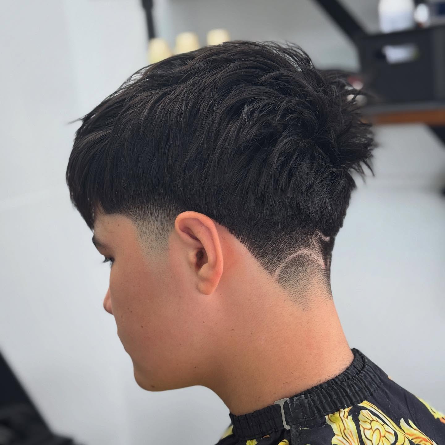 Edgy Textured Taper Fade with Creative Design