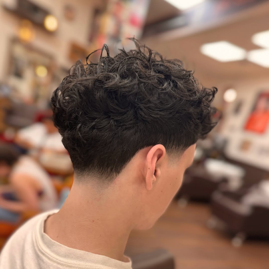 Modern Curly Blowout with Tapered Nape
