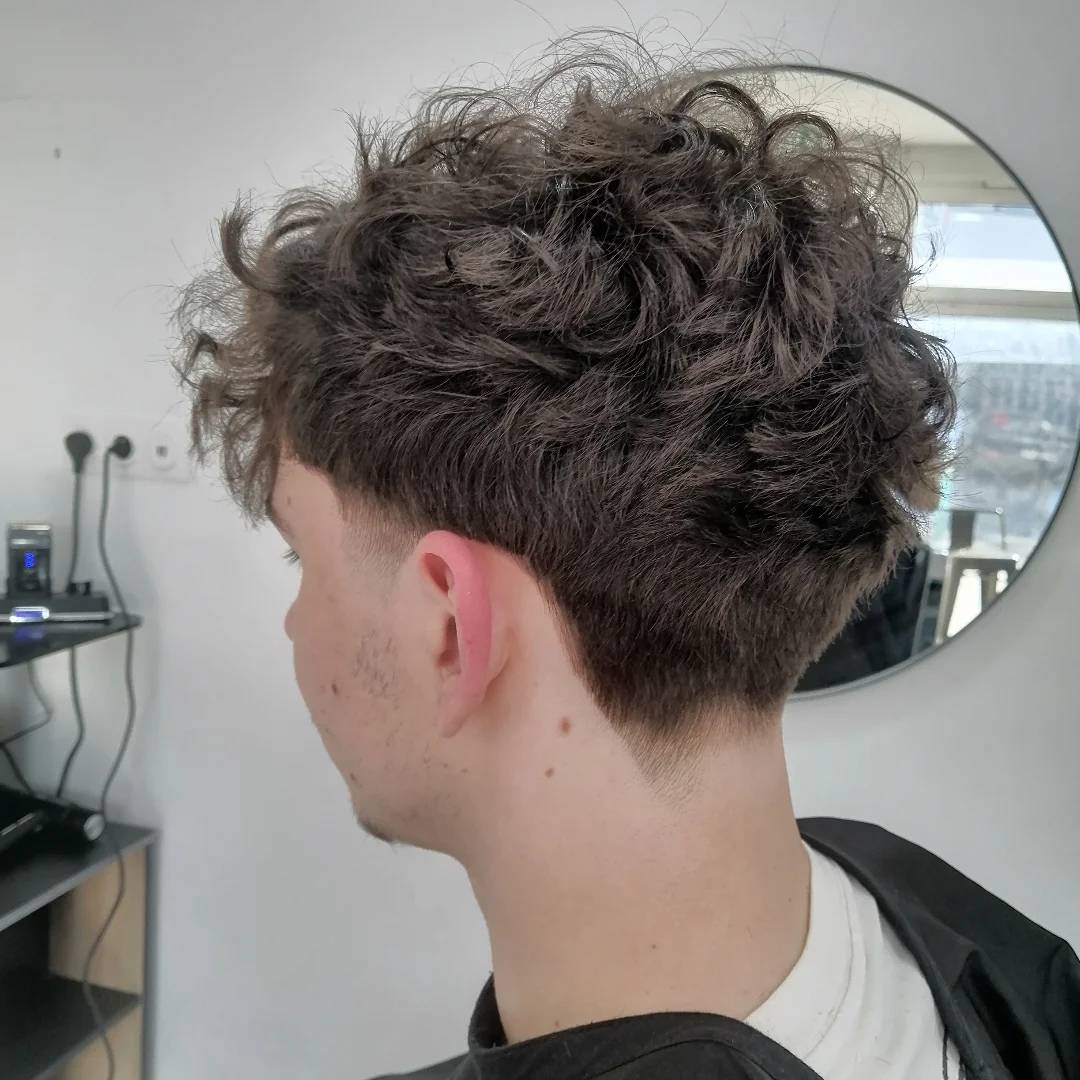 Modern Curly Blowout with Tapered Sides
