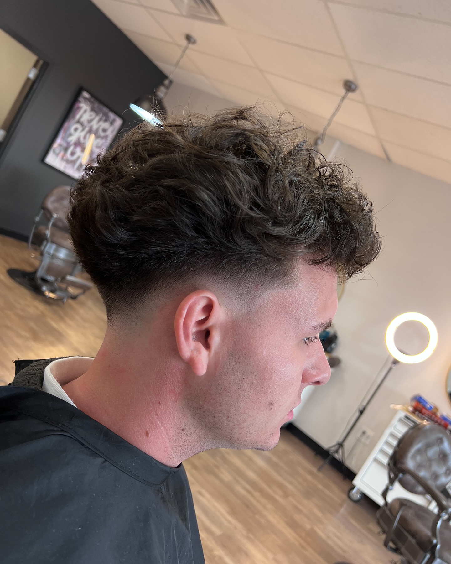 Modern Curly Taper Fade with Textured Volume