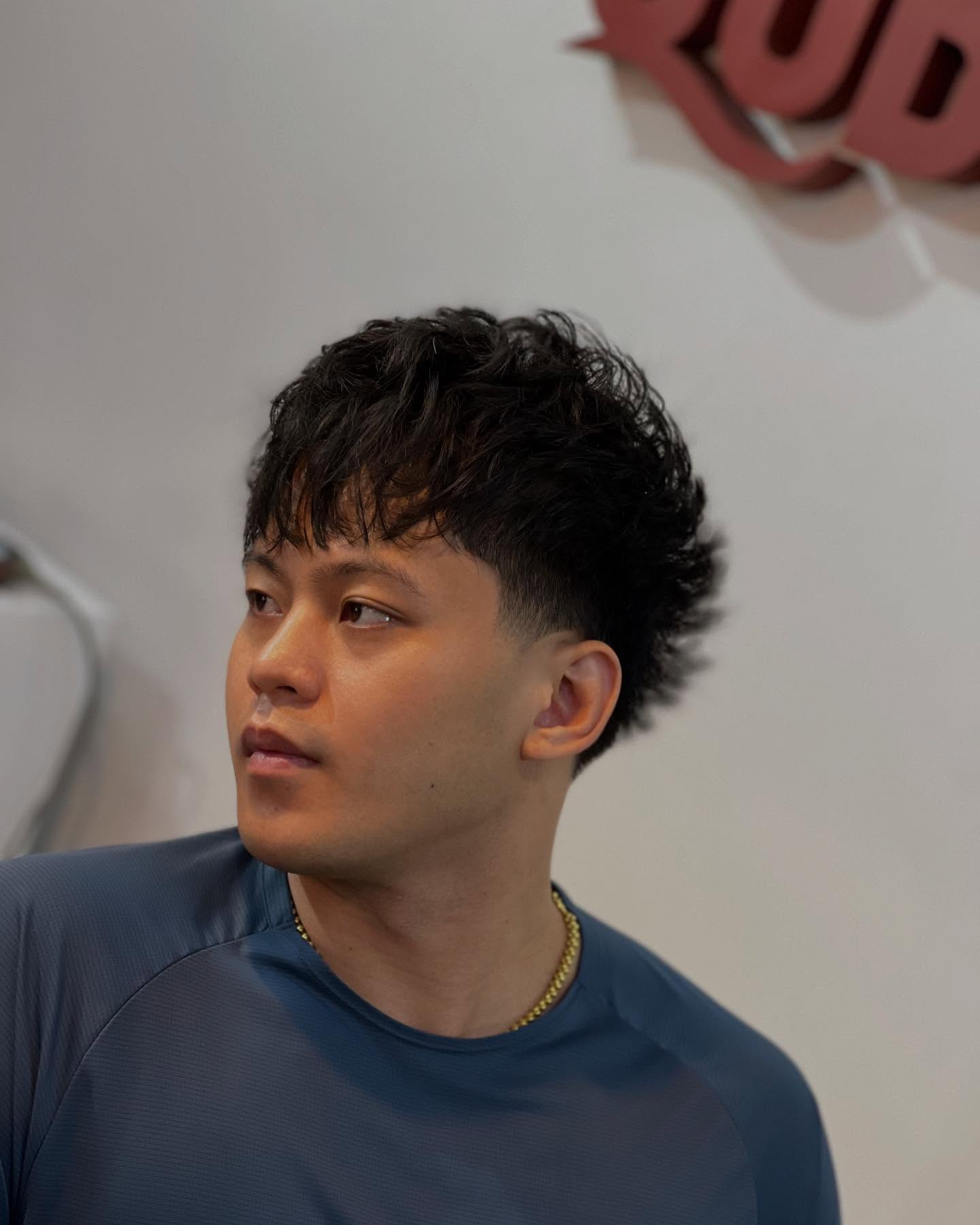 Modern Textured Blowout Taper Fade with Defined Curls