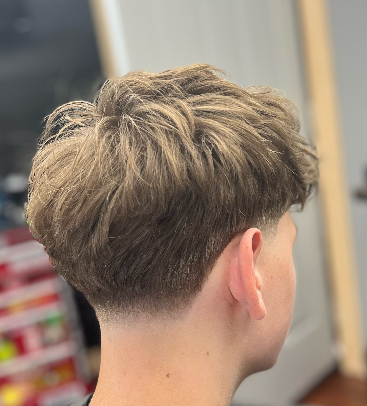 Stylish Curly Taper Fade with Textured Top