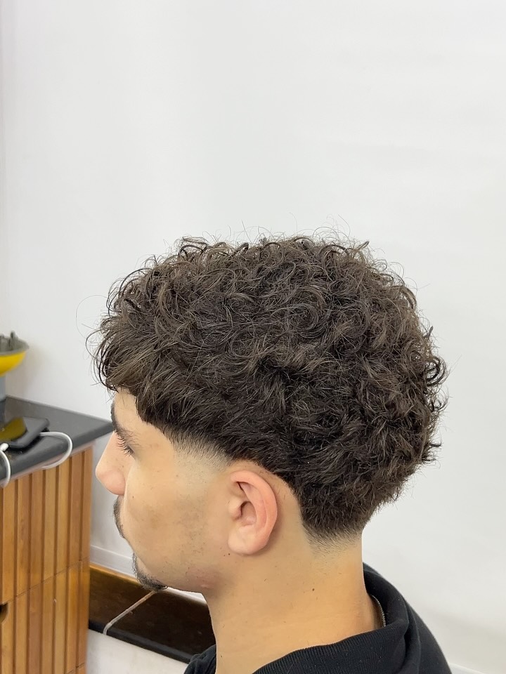 Textured Curly Taper Fade with Defined Volume