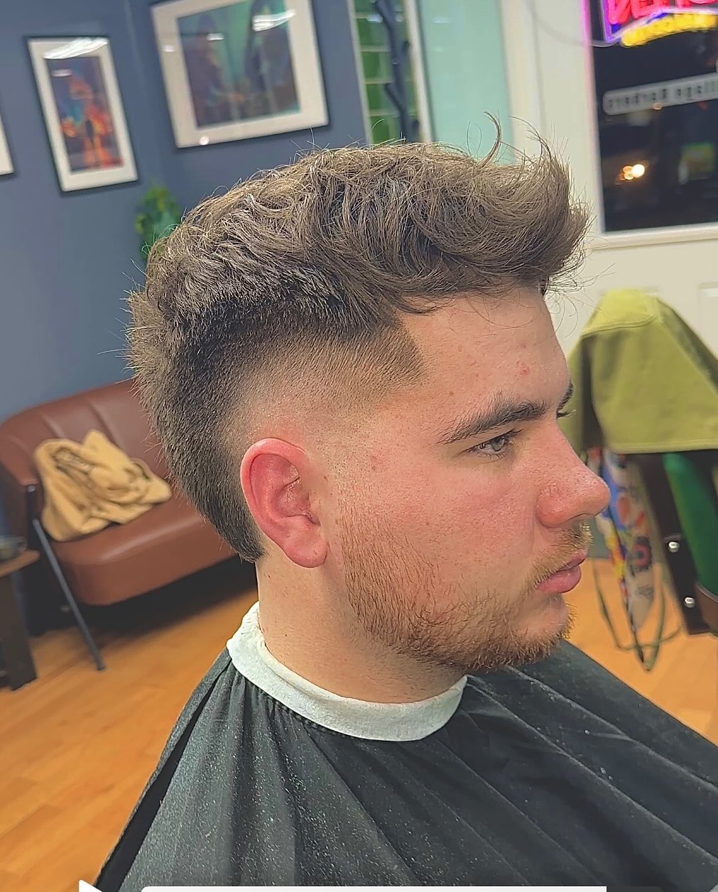 Bold Textured Burst Fade Mohawk with Defined Volume