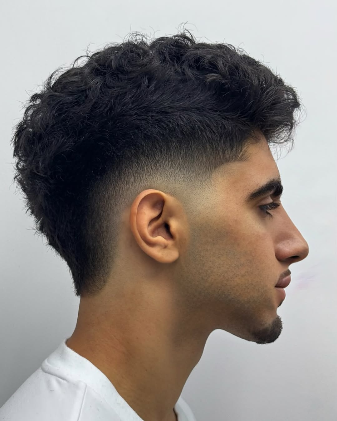 Dynamic Curly Mohawk with Tapered Sides