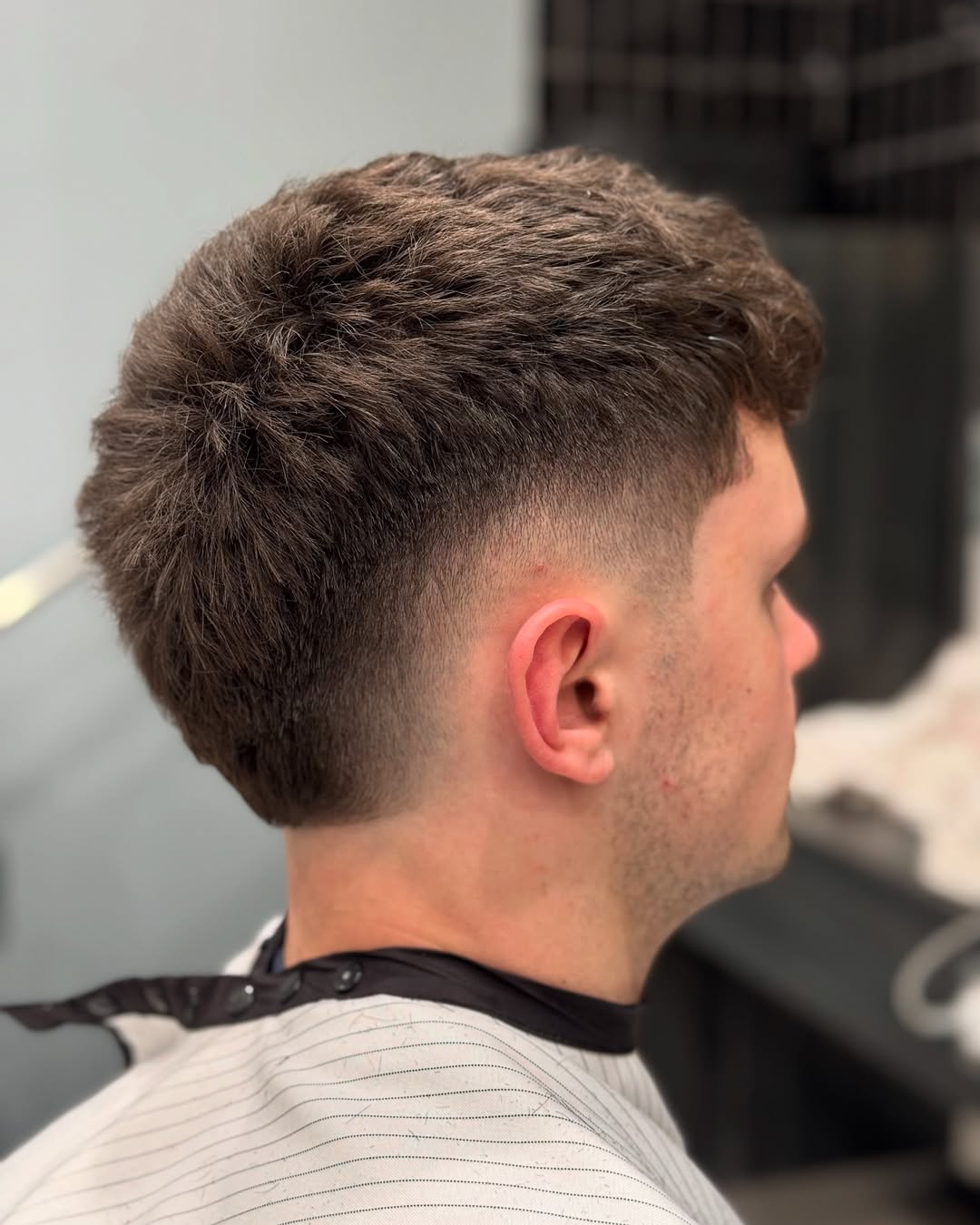 Textured Burst Fade Mohawk with Defined Layers