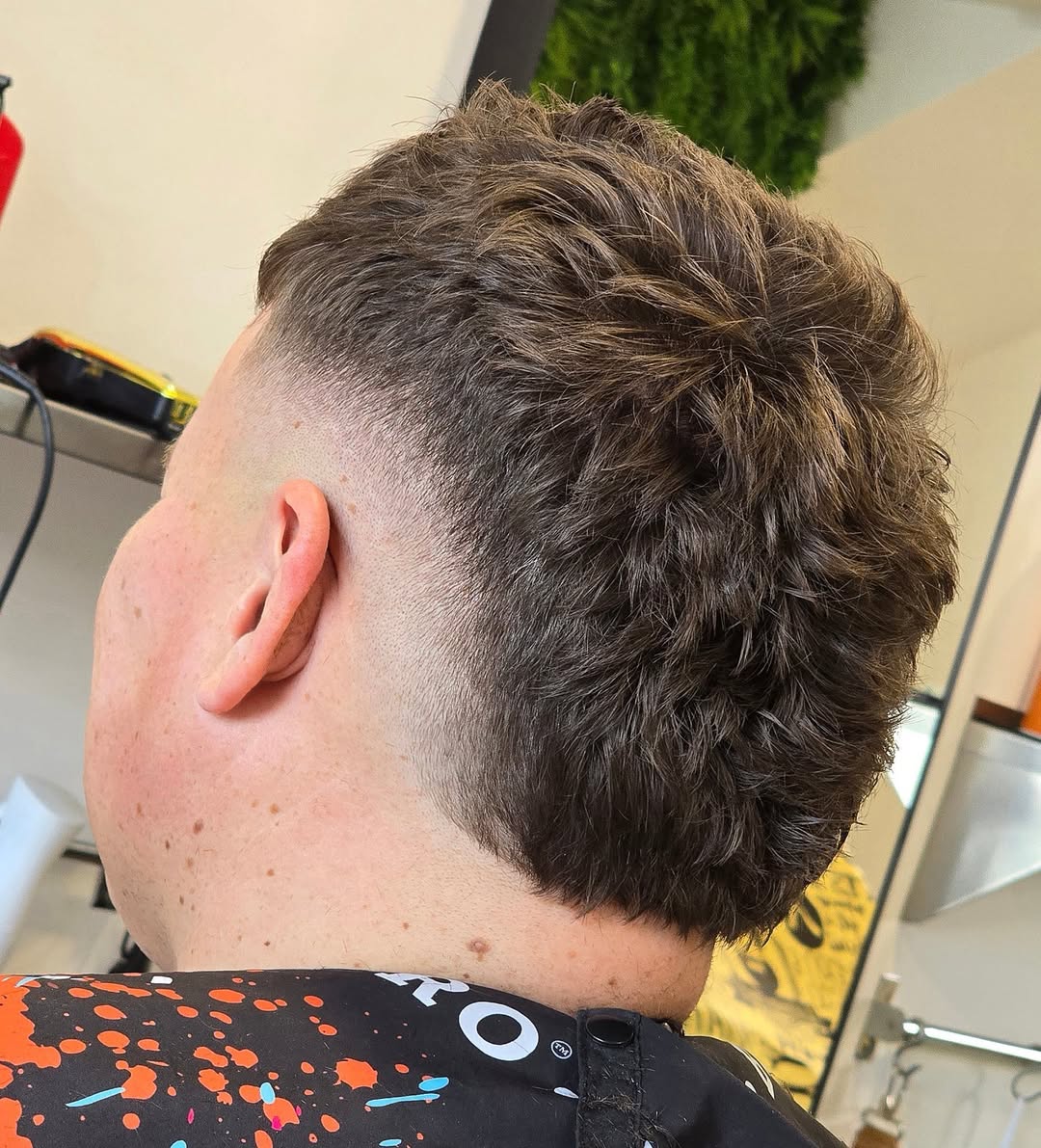 Textured Burst Fade Mohawk with Defined Volume