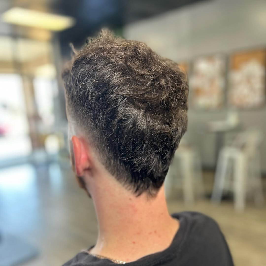 Textured Burst Fade Mohawk with Natural Waves