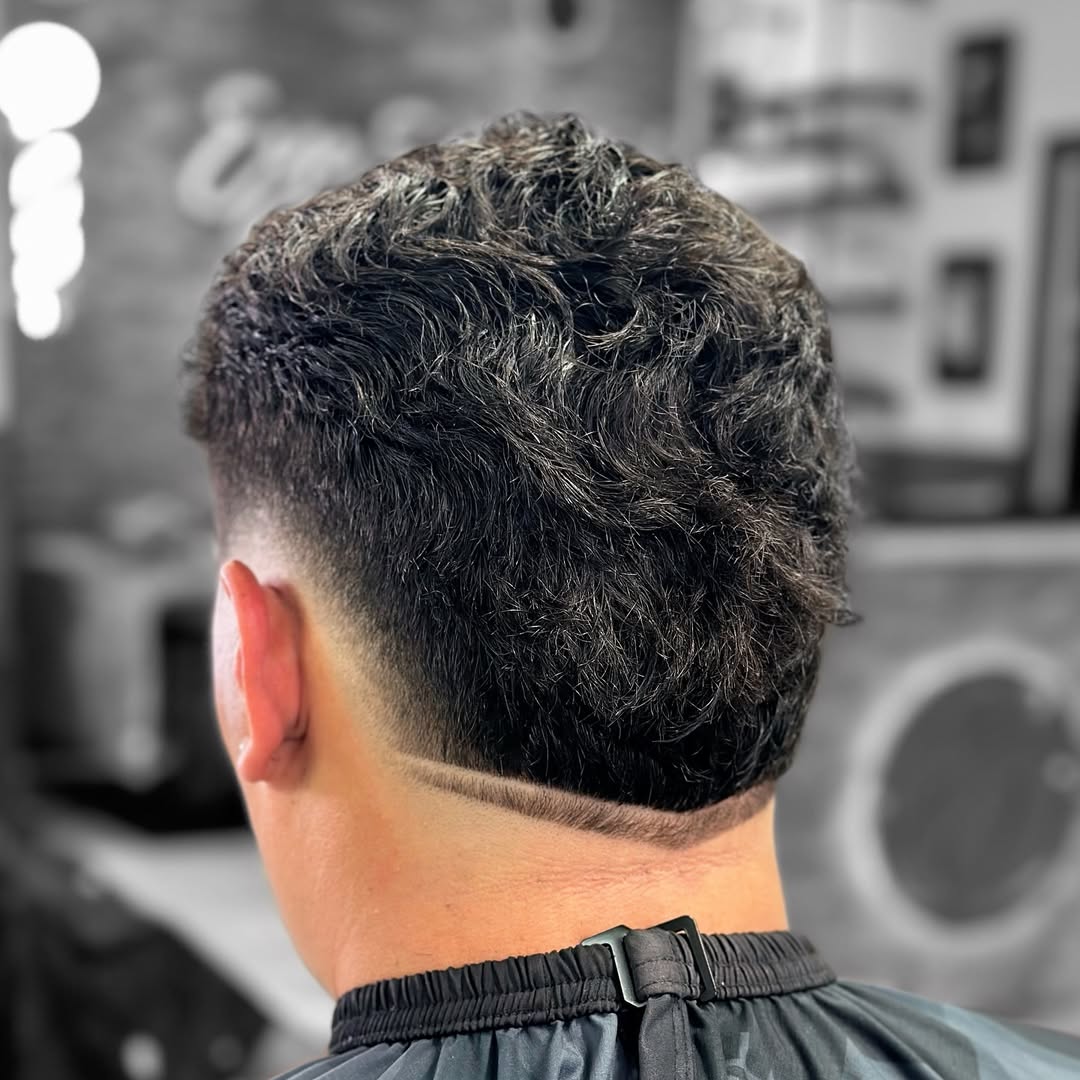 Textured Burst Fade Mohawk with Subtle Undercut