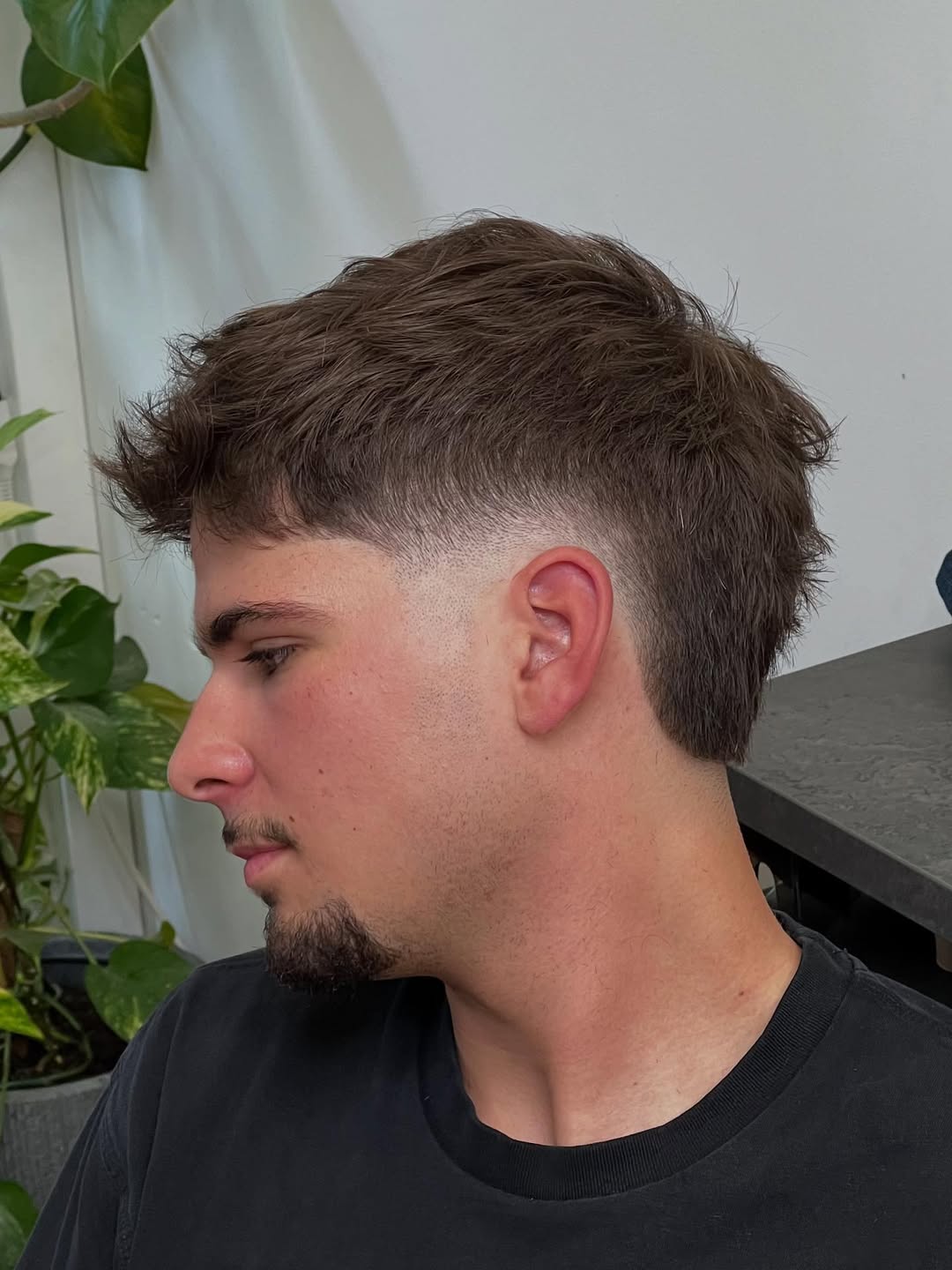 Textured Burst Fade Mohawk with Tapered Sides