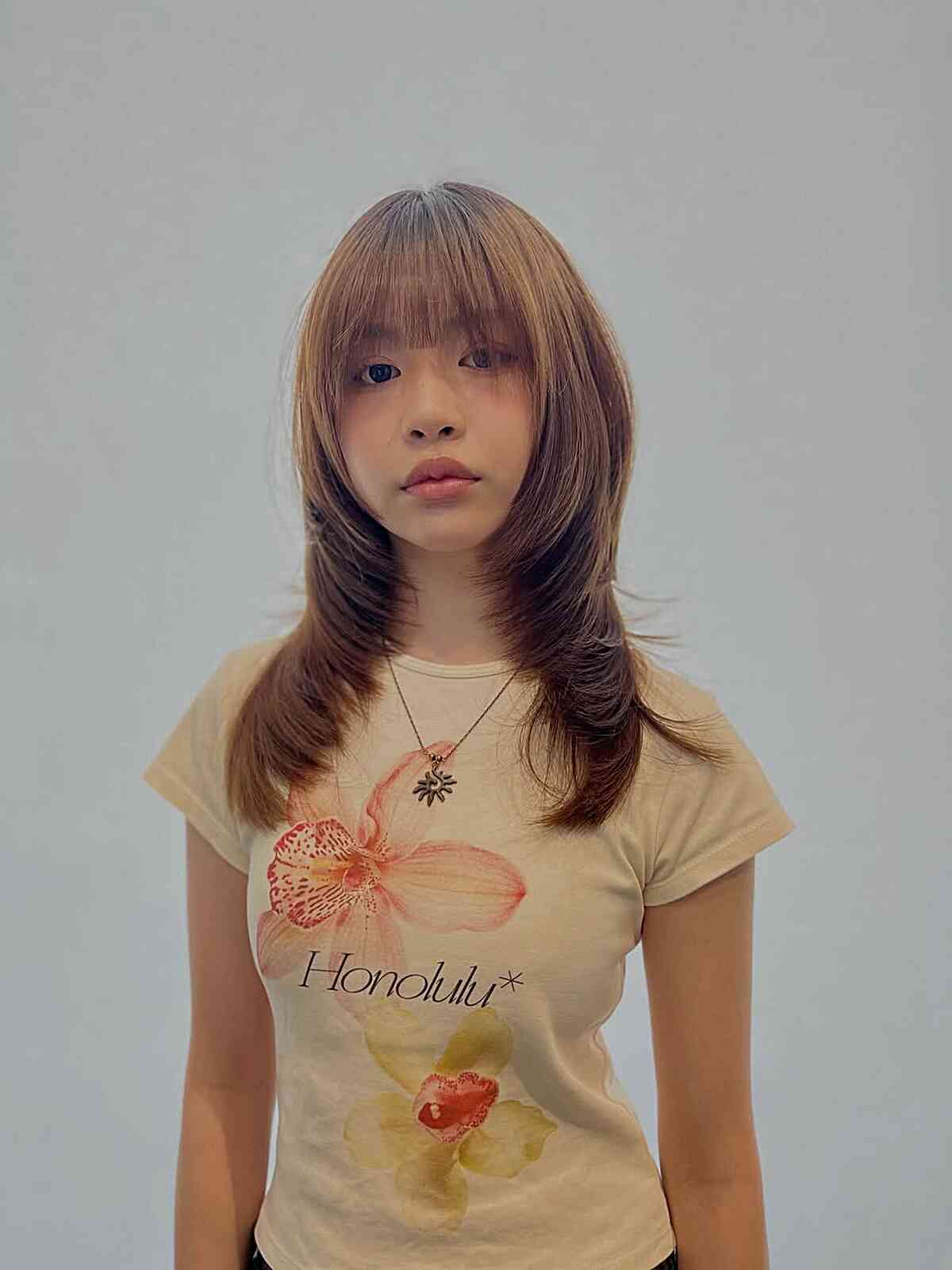 Stylish Mid-Length Layered Cut with Soft Bangs