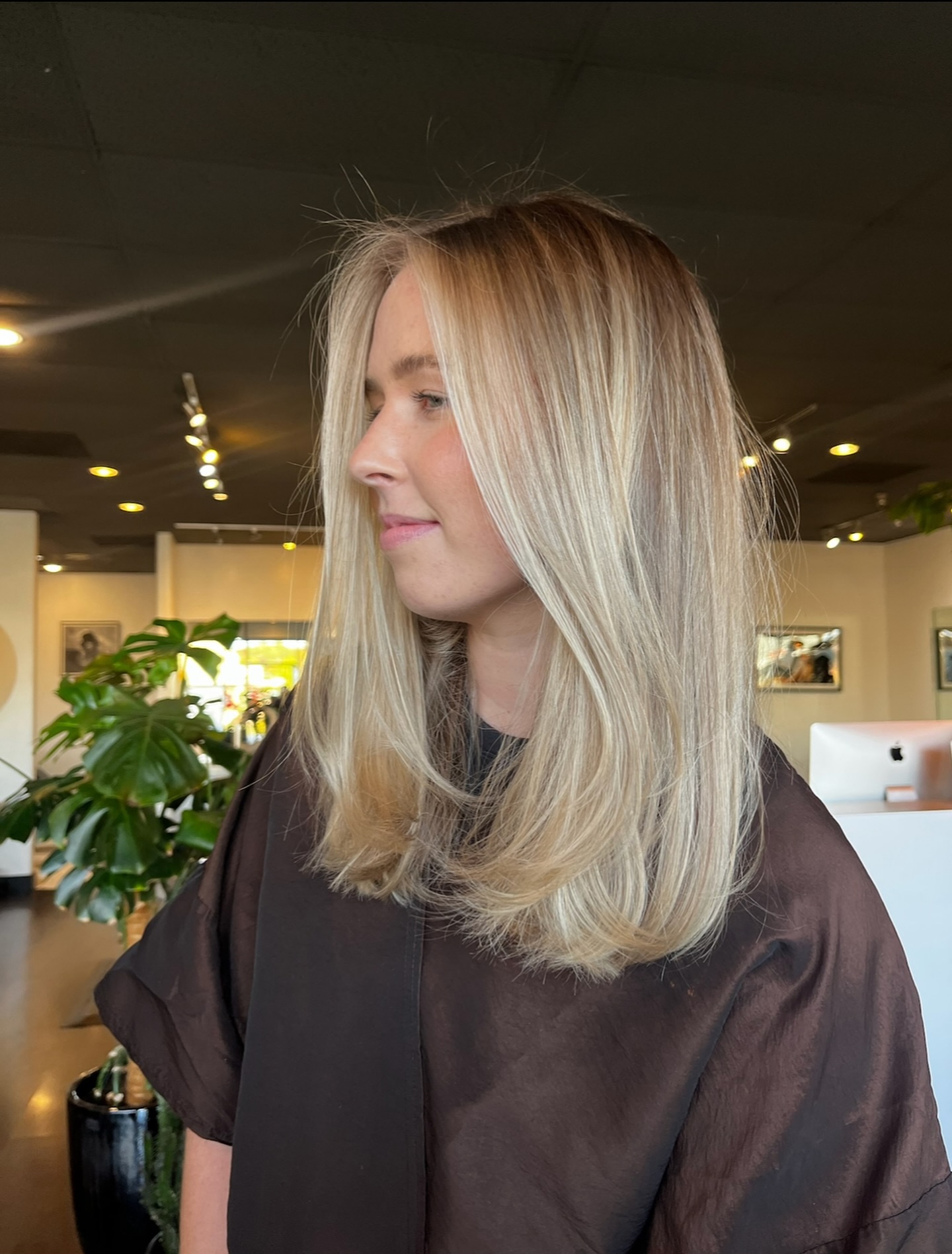 Soft Face-Framing Mid-Length Layers with Root-Melt Blonde Balayage