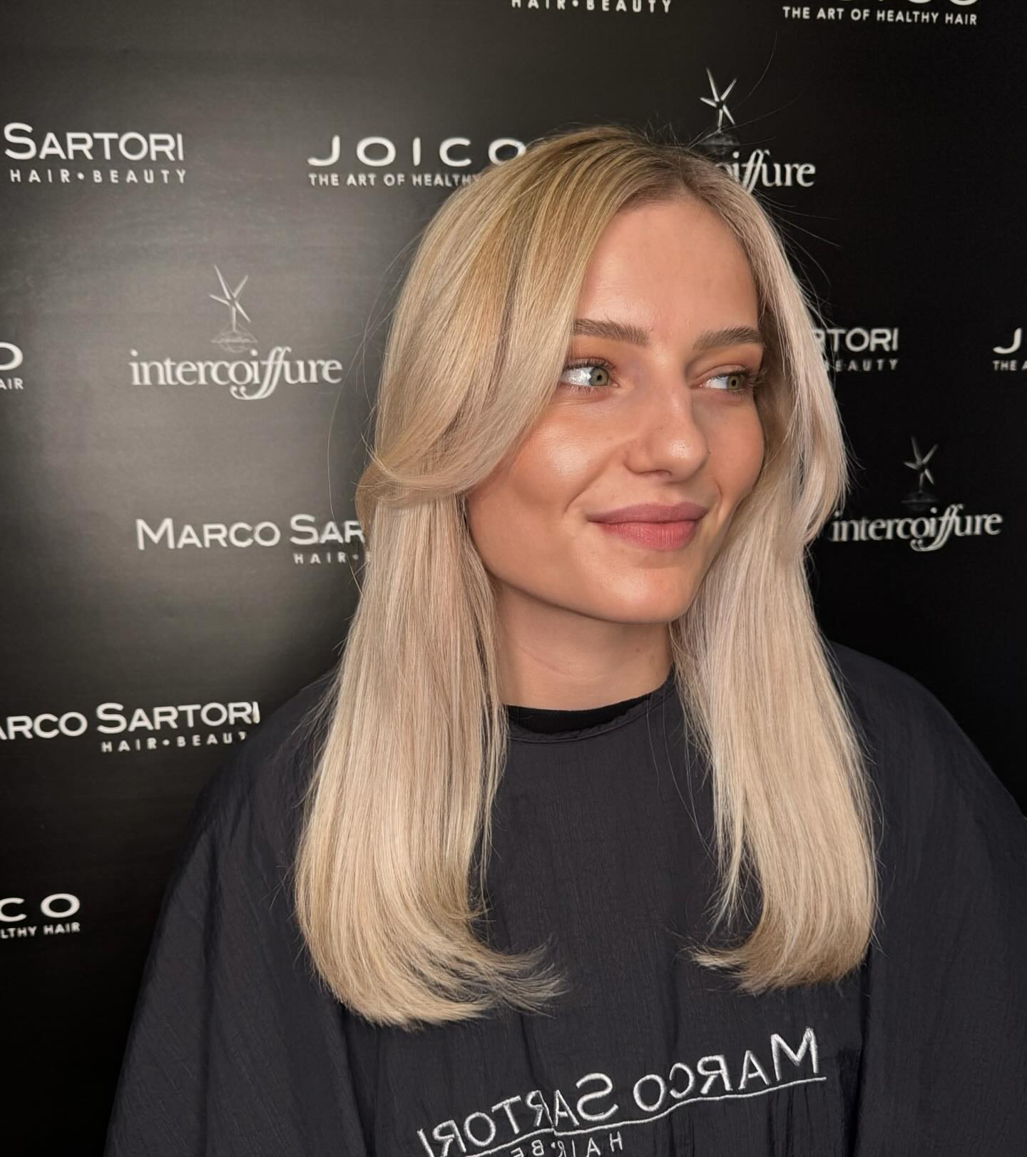 Blonde Mid-Length Round-Brush Blowout with Subtle Face-Framing Layers