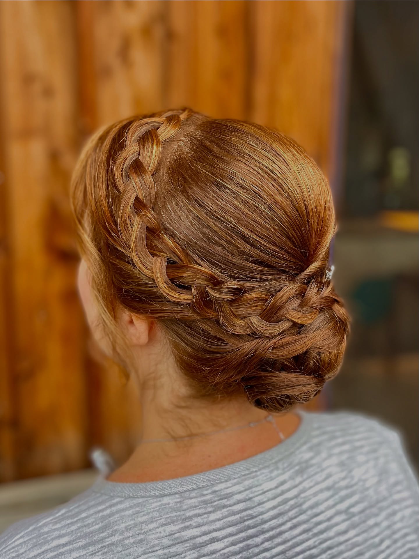 Braided Crown Into Twisted Low Chignon with Warm Copper Depths