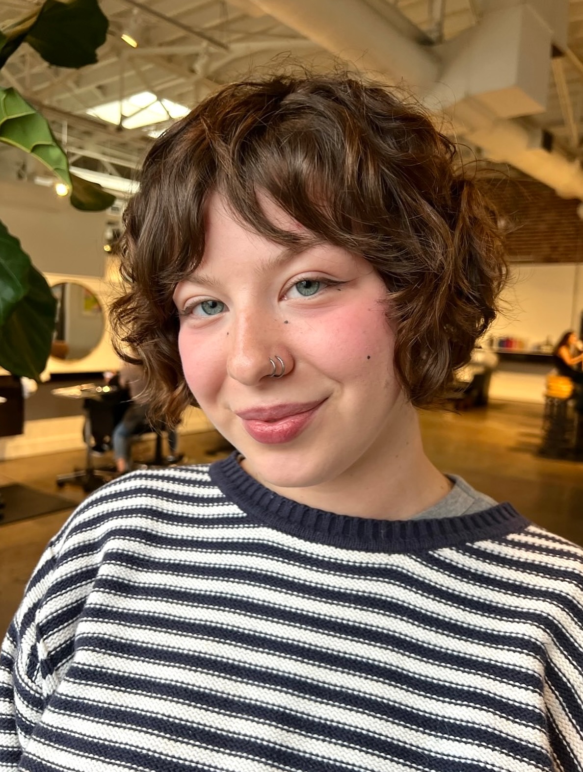 Chin-Length Tousled Curly Bob with Soft Blended Fringe