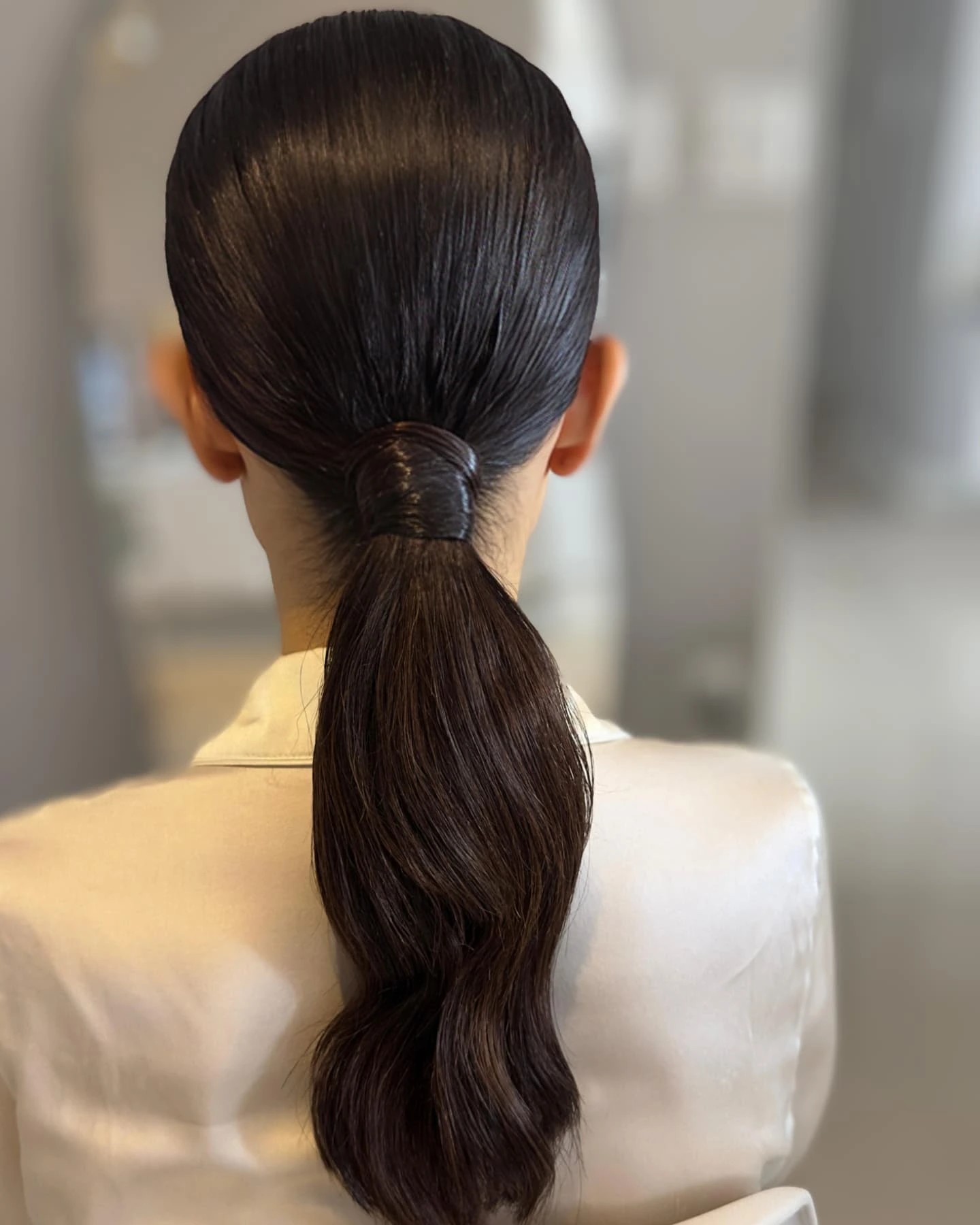 Glossy Wrapped Low Ponytail with Blunt-Weight Tail