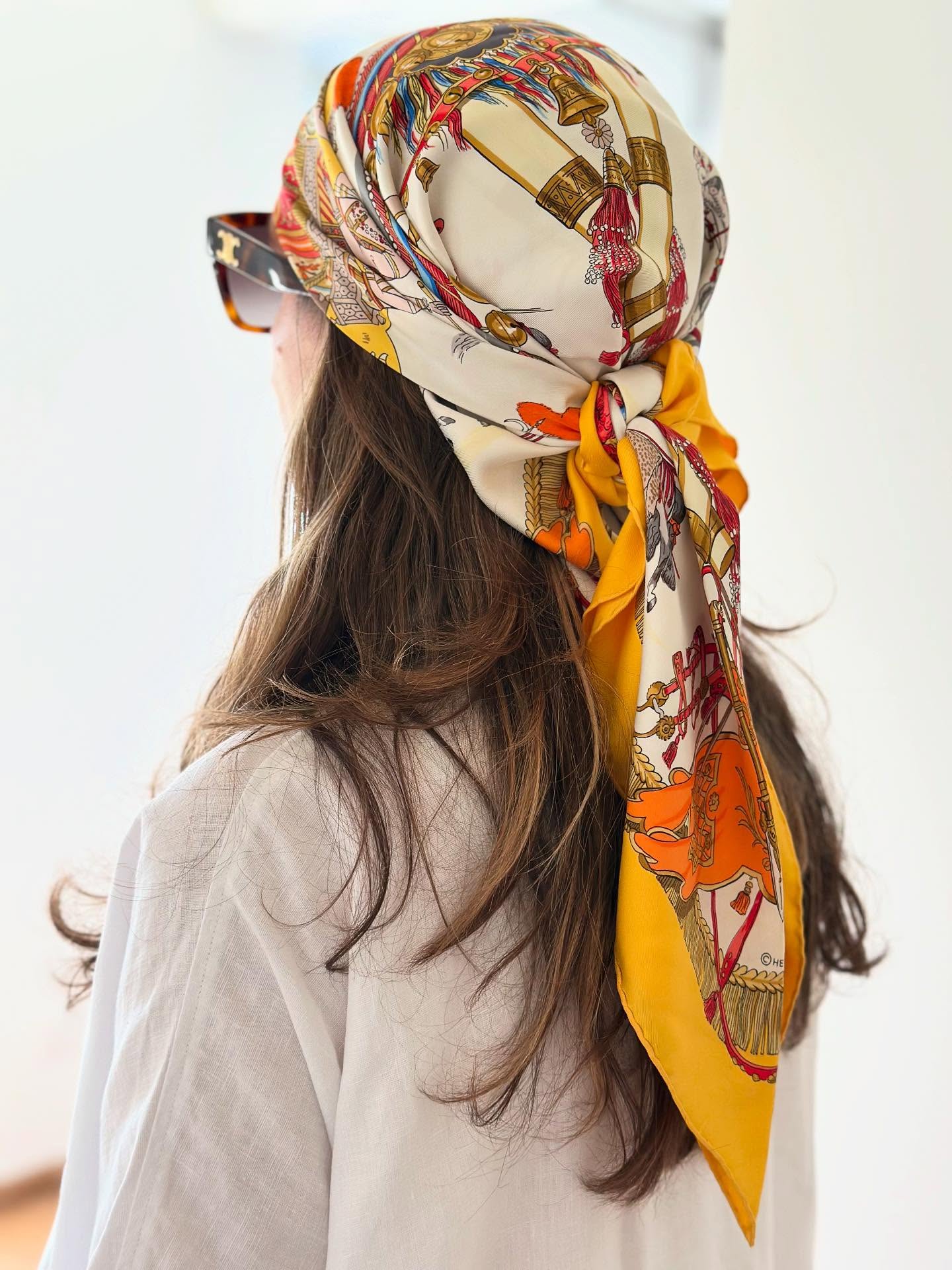 Long Feathered Layers with Low-Tied Silk Scarf