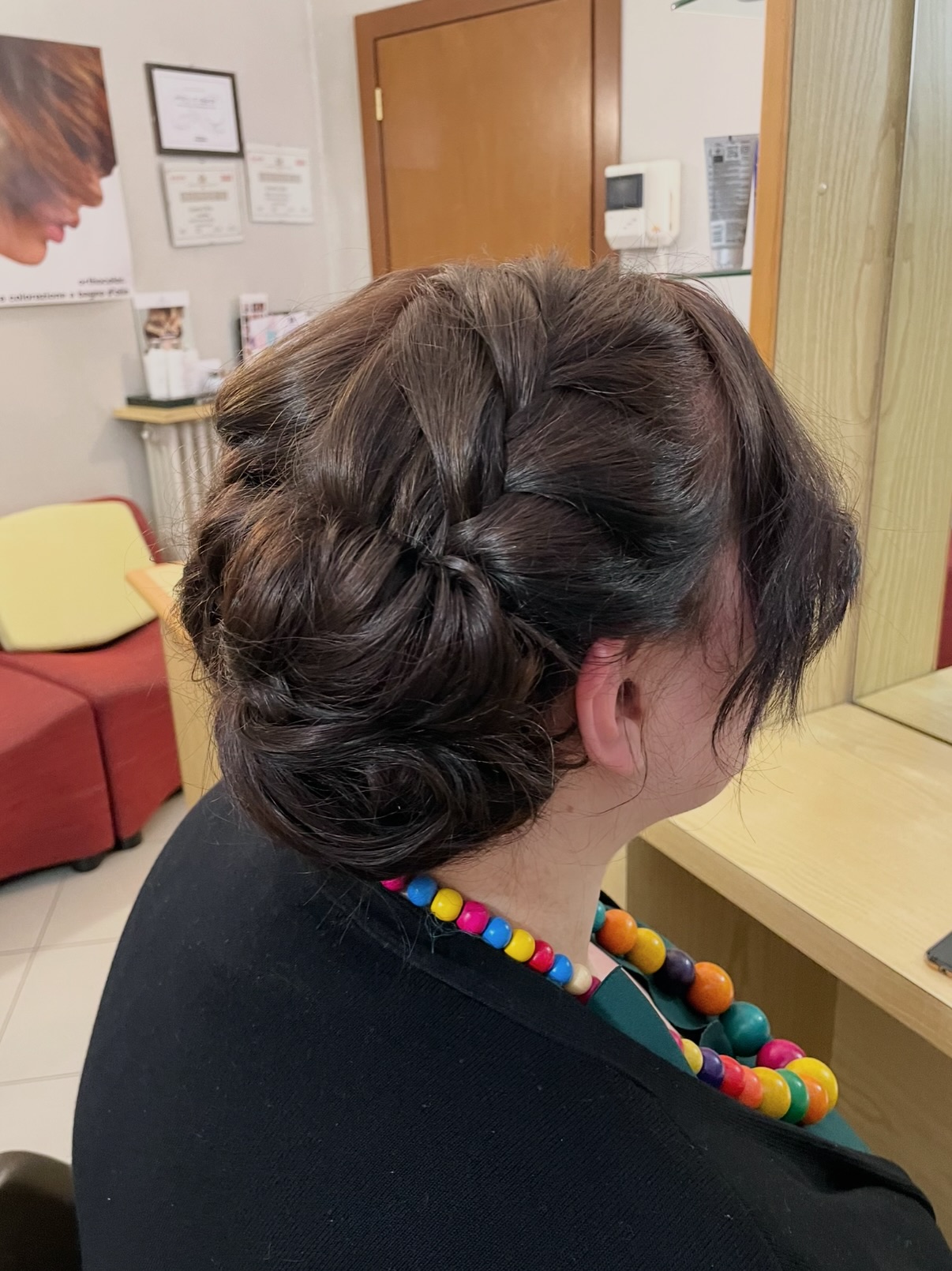 Low Braided Tucked Chignon with Side-Swept Fringe