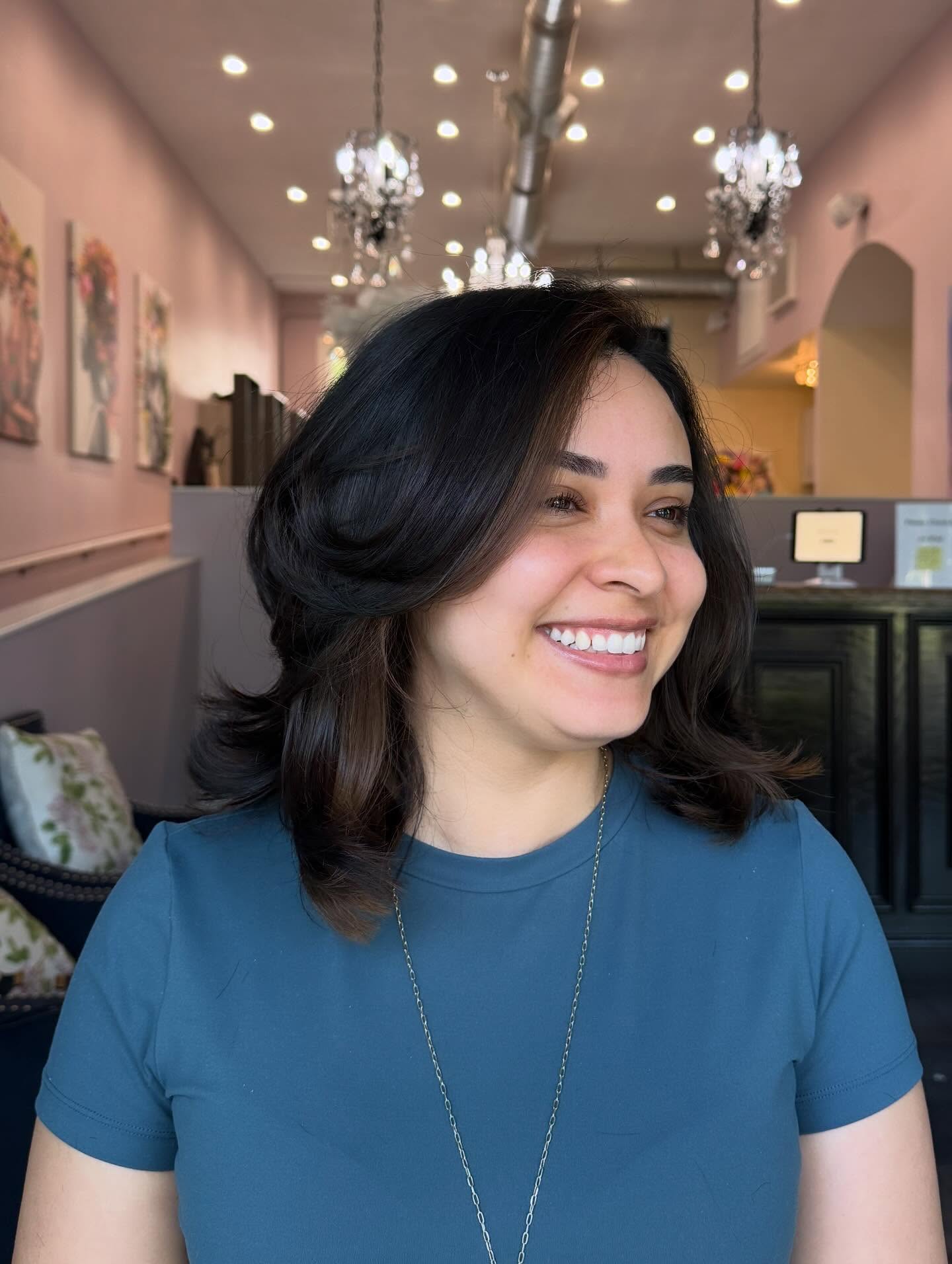 Medium-Length Feathered Blowout with Face-Framing Peekaboo Lowlights